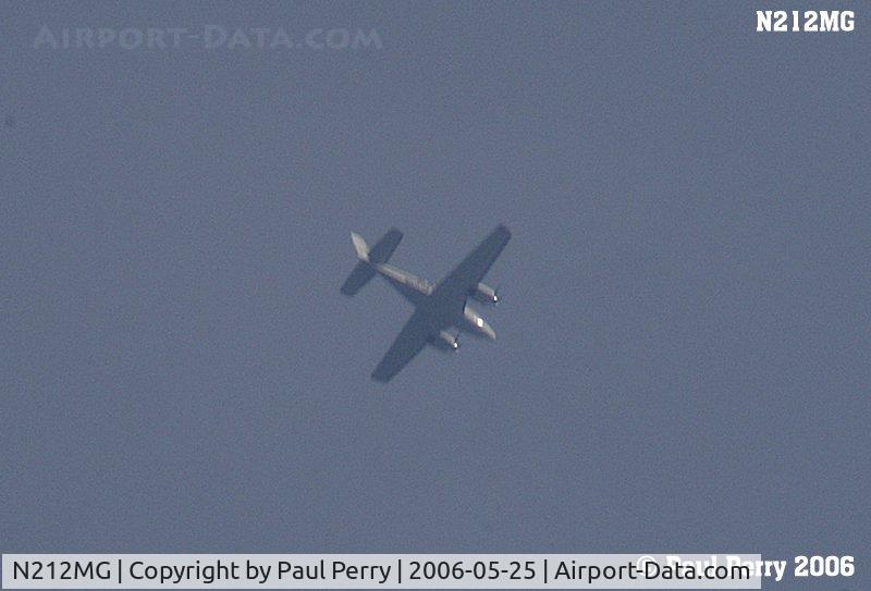N212MG, Raytheon Aircraft Company 58 C/N TH-2117, Cruising over Ahoskie, NC at 8000AGL.  Sorry for the blur