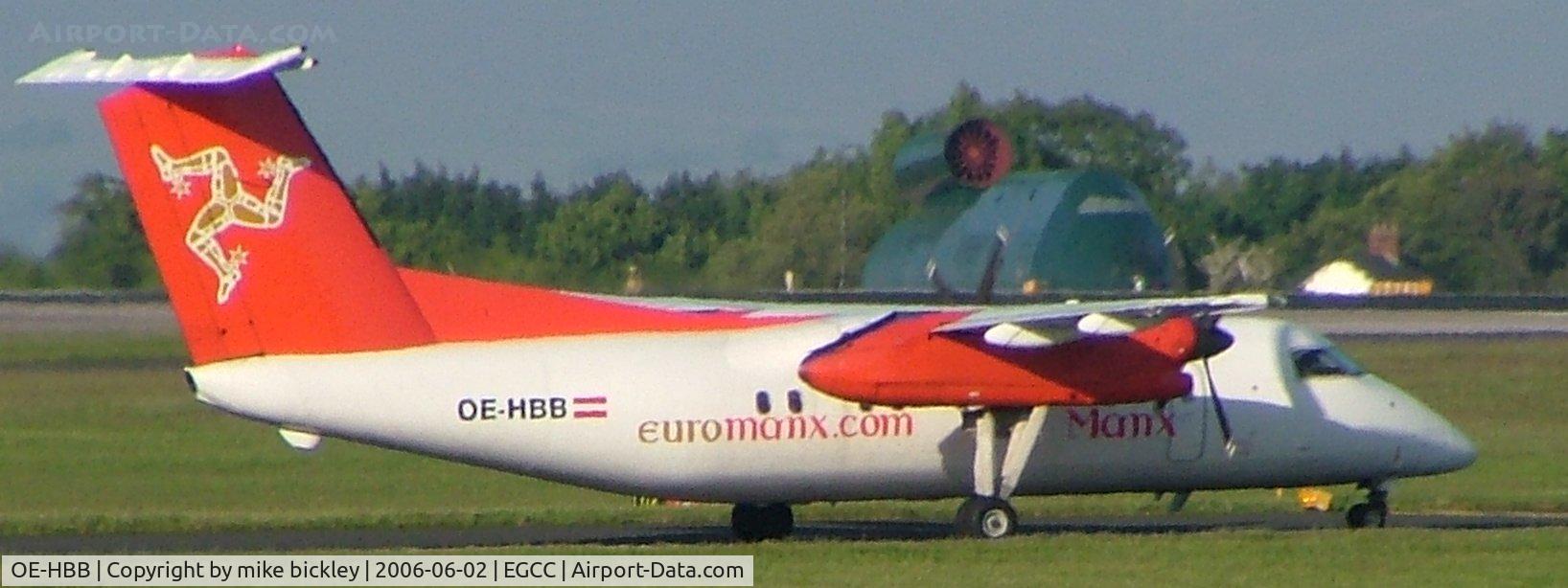 OE-HBB, 2000 De Havilland Canada DHC-8-402 Dash 8 C/N 541, notice training facility in backgroud