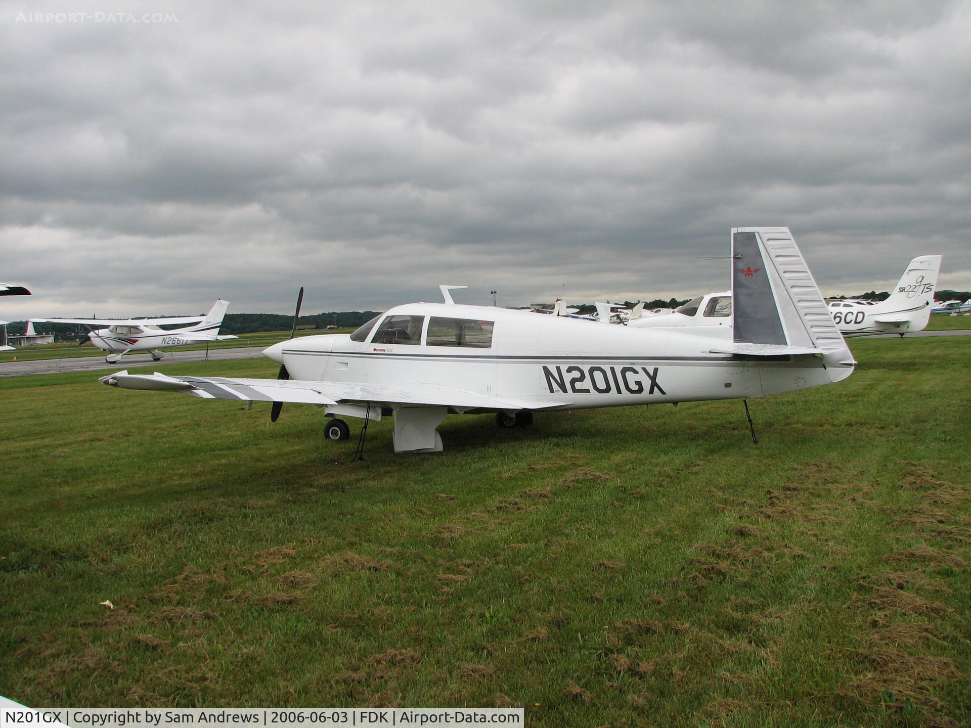 N201GX, 1977 Mooney M20J 201 C/N 24-0225, Sitting on the grass at the AOPA Fly-In 2006