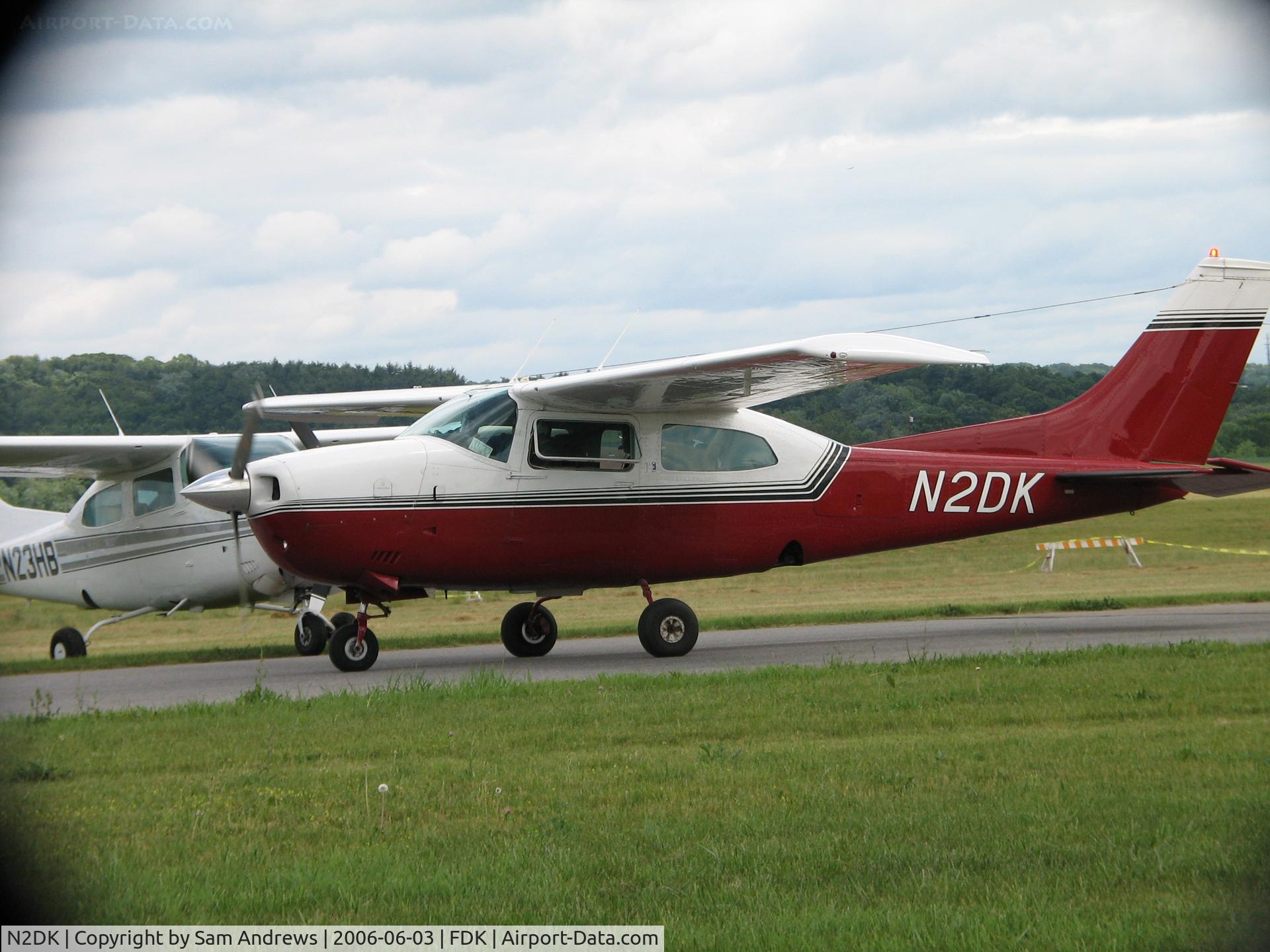 N2DK, 1974 Cessna 210L Centurion C/N 21060461, Taxiing out to go from whence they came after a long day at the AOPA Fly-In 2006