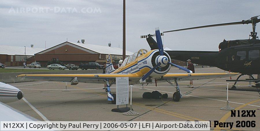 N12XX, 2002 Yakovlev (Aerostar) Yak-52TW C/N 0112232, Yak taildragger parked amidst the NASA birds