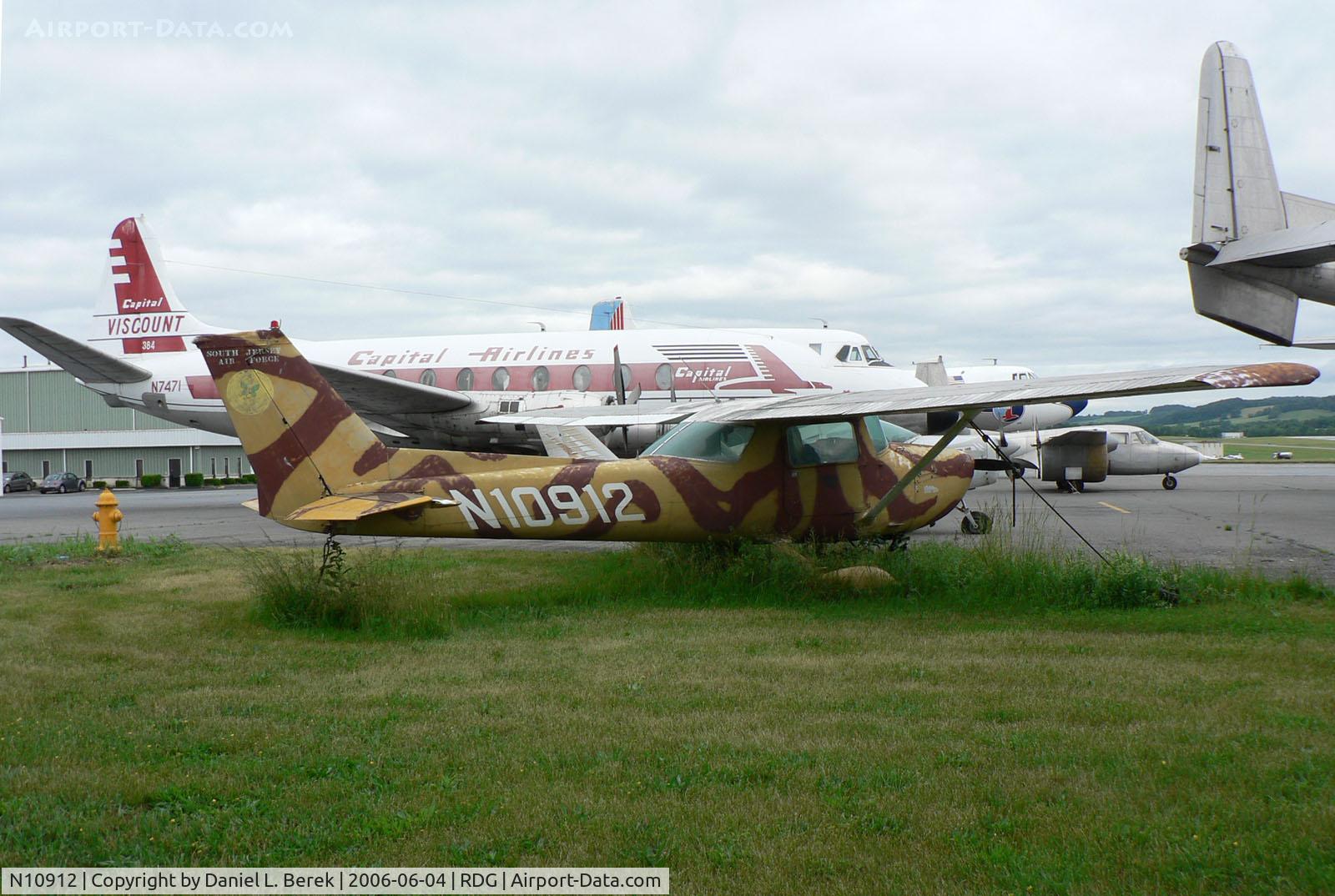 N10912, 1973 Cessna 150L C/N 15075127, This poor 1973 Cessna 150L takes root, enduring the further indignity of a pseudo-military cammo paint scheme.