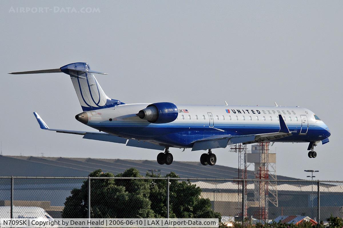 N709SK, 2004 Bombardier CRJ-701ER (CL-600-2C10) Regional Jet C/N 10159, United Express (Skywest Airlines) N709SK (FLT SKW6489) from Portland Int'l (KPDX) seconds from touchdown on RWY 24R.