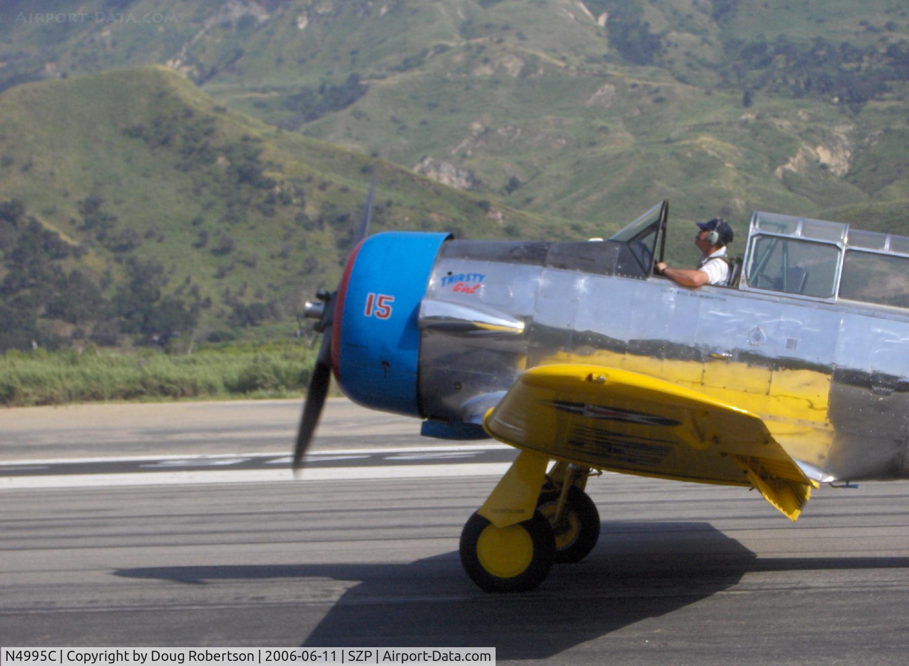 N4995C, 1949 North American T-6G Texan C/N 168-481, North American T-6G TEXAN (1949 factory reman) 'Thirsty Girl' fast taxi toward hangar after landing