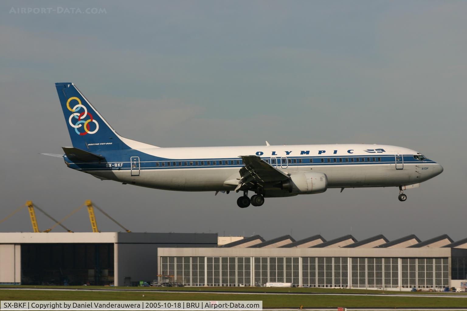 SX-BKF, 1991 Boeing 737-484 C/N 25430, landing on rnw 02 - look at workshop 40, now destroyed by fire