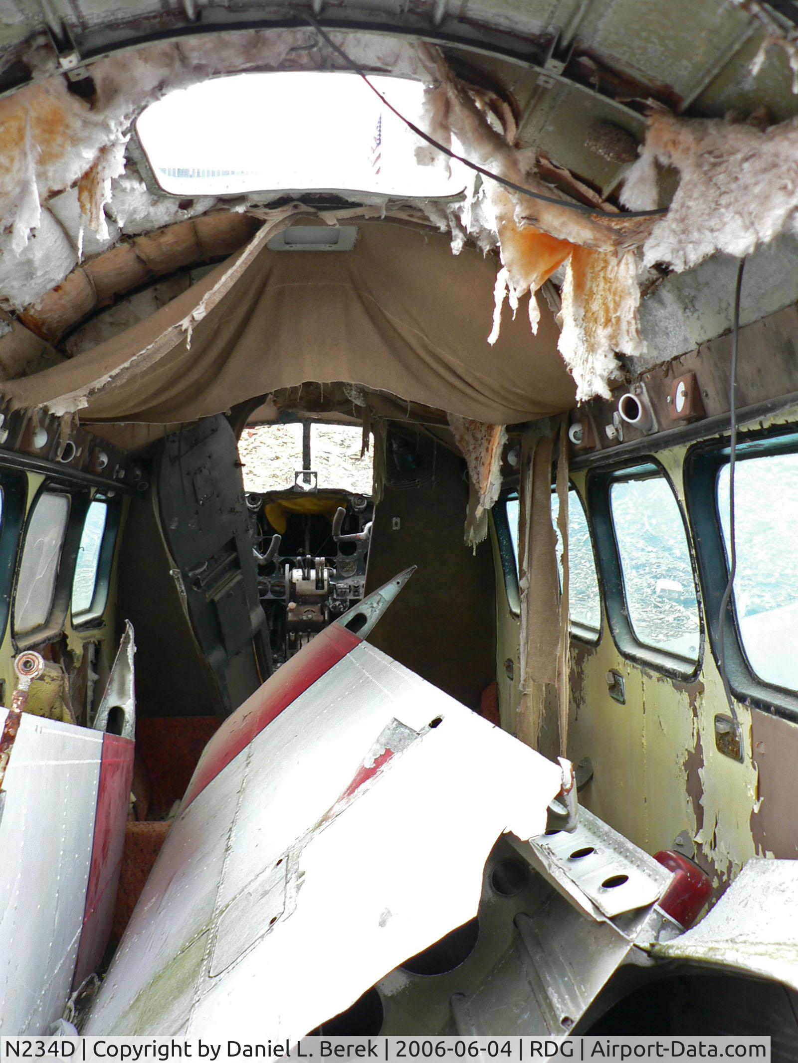 N234D, 1959 De Havilland DH-104 Dove 6A C/N 04387, One of two De Havilland DH-104 Doves near the Mid Atlantic Air Museum, this specimen (built circa 1959) is the worse off of the two. A view of the interior does not help matters.