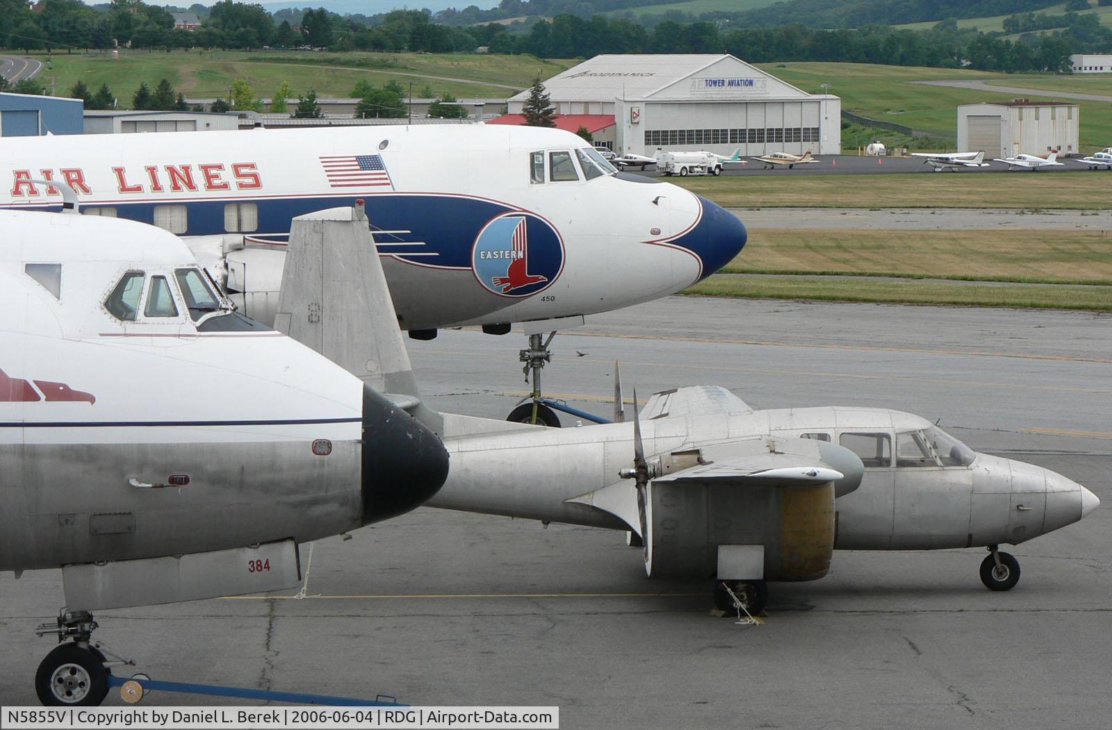 N5855V, 1964 Custer Channel Wing CCW-5 C/N 1, This Channel Wing is nestled between a Vickers Viscount and a Martin 404.