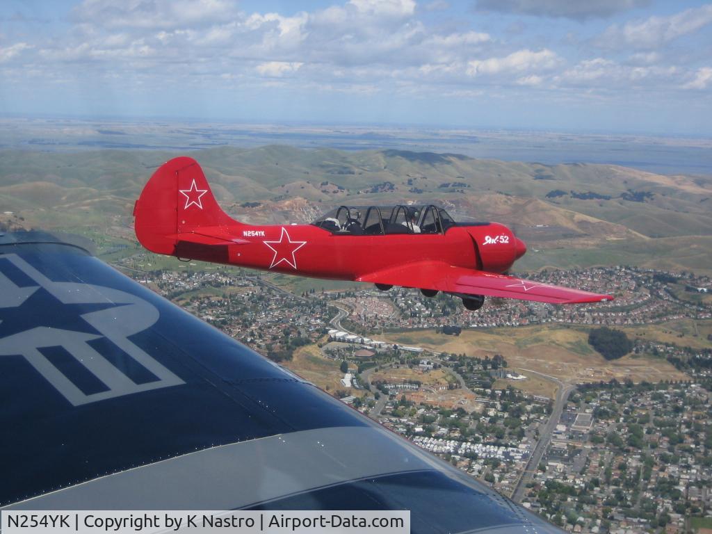 N254YK, 1985 Yakovlev Yak-52 C/N 855410, Touring the Bay with a T-34