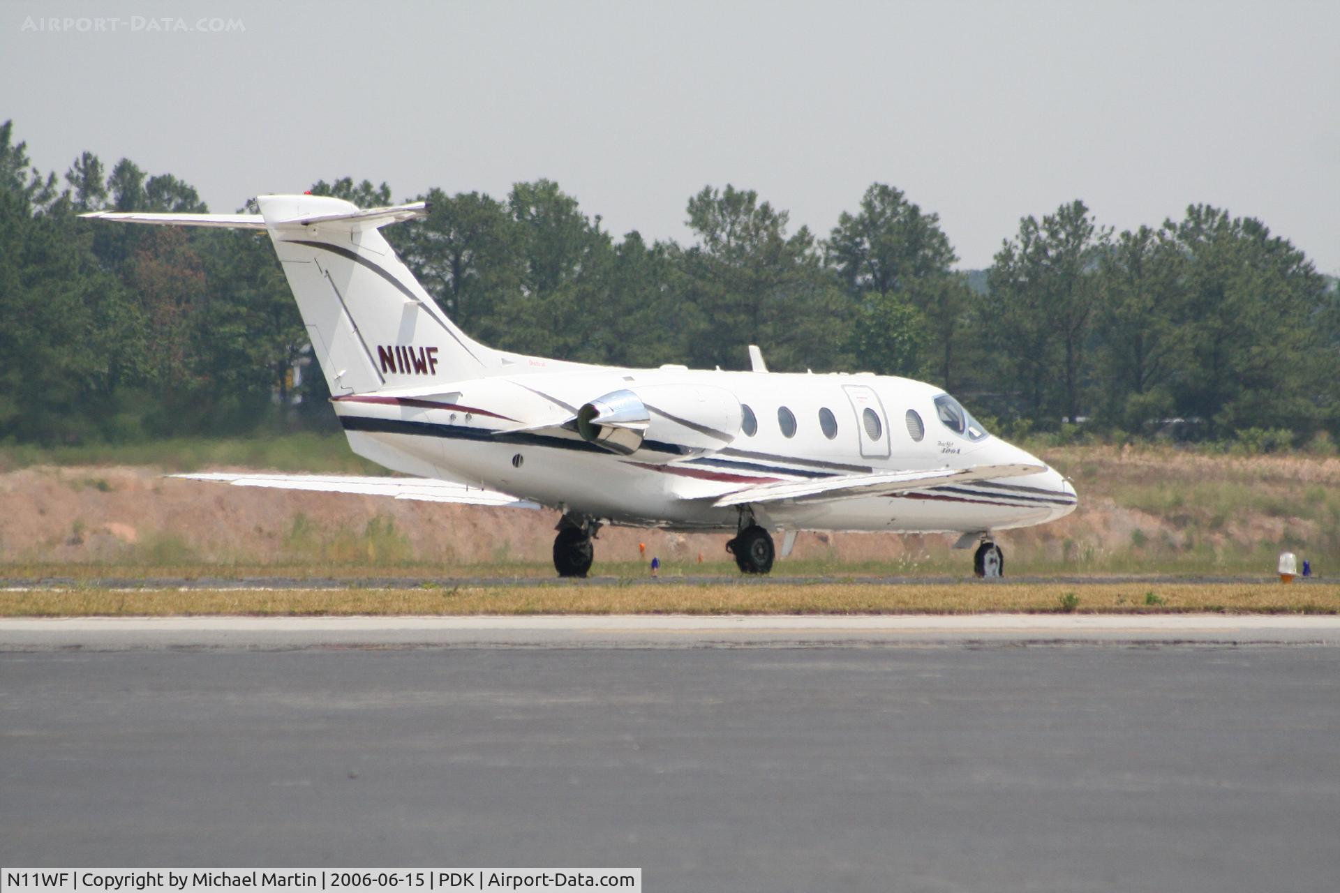 N11WF, 1999 Raytheon Beechjet 400A C/N RK-236, Taxing to 20R