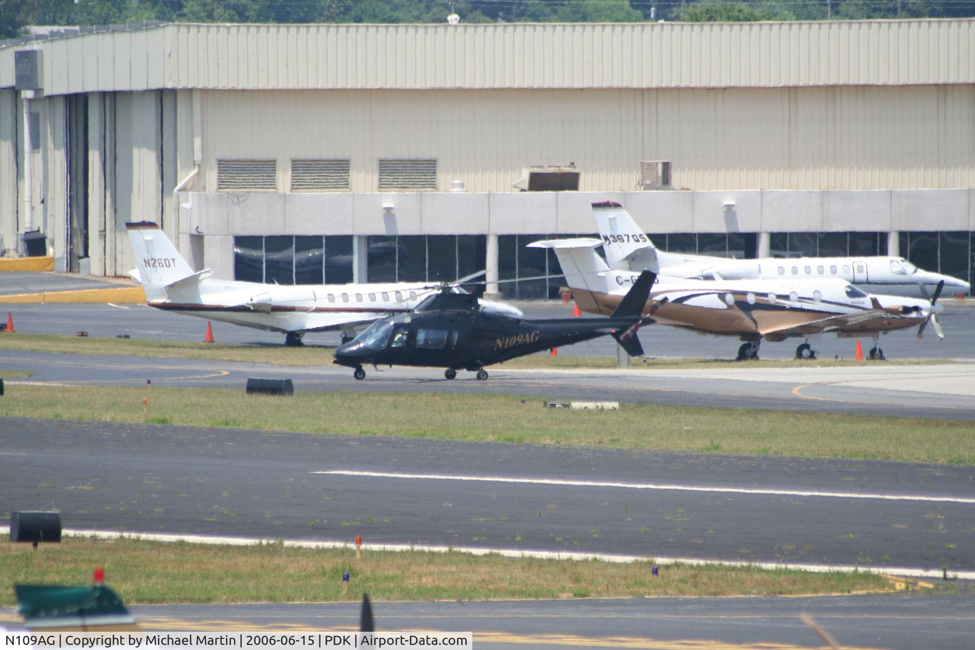 N109AG, 1984 Agusta A109A II C/N 7260, Taxing to Charlie Pad, preparing to take off.