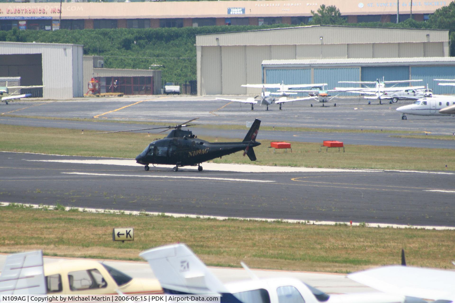 N109AG, 1984 Agusta A109A II C/N 7260, Taxing to Charlie Pad, preparing to take off.
