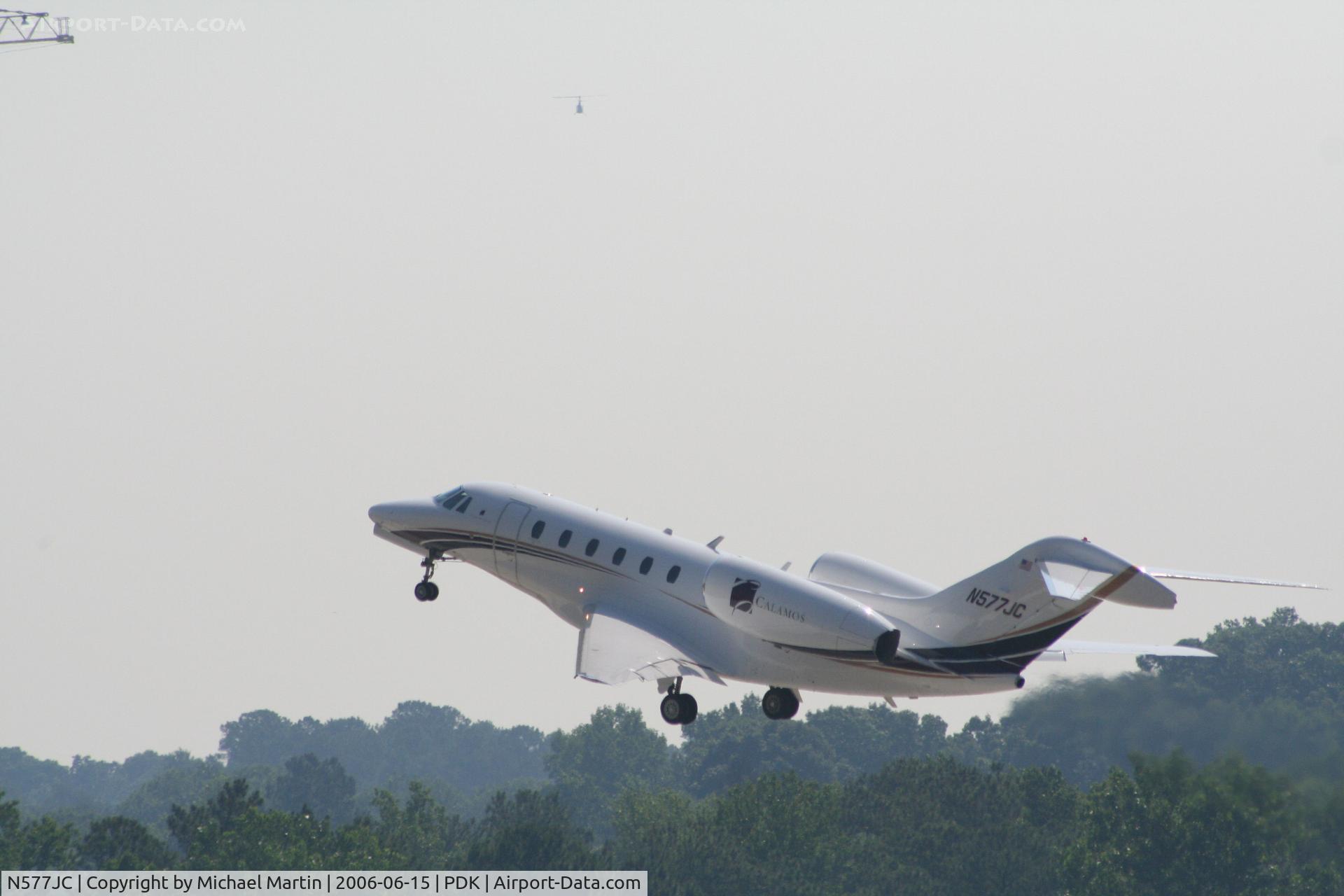 N577JC, 2000 Cessna 750 Citation X Citation X C/N 750-0122, Departing 20R - Note Helicopter in distance!