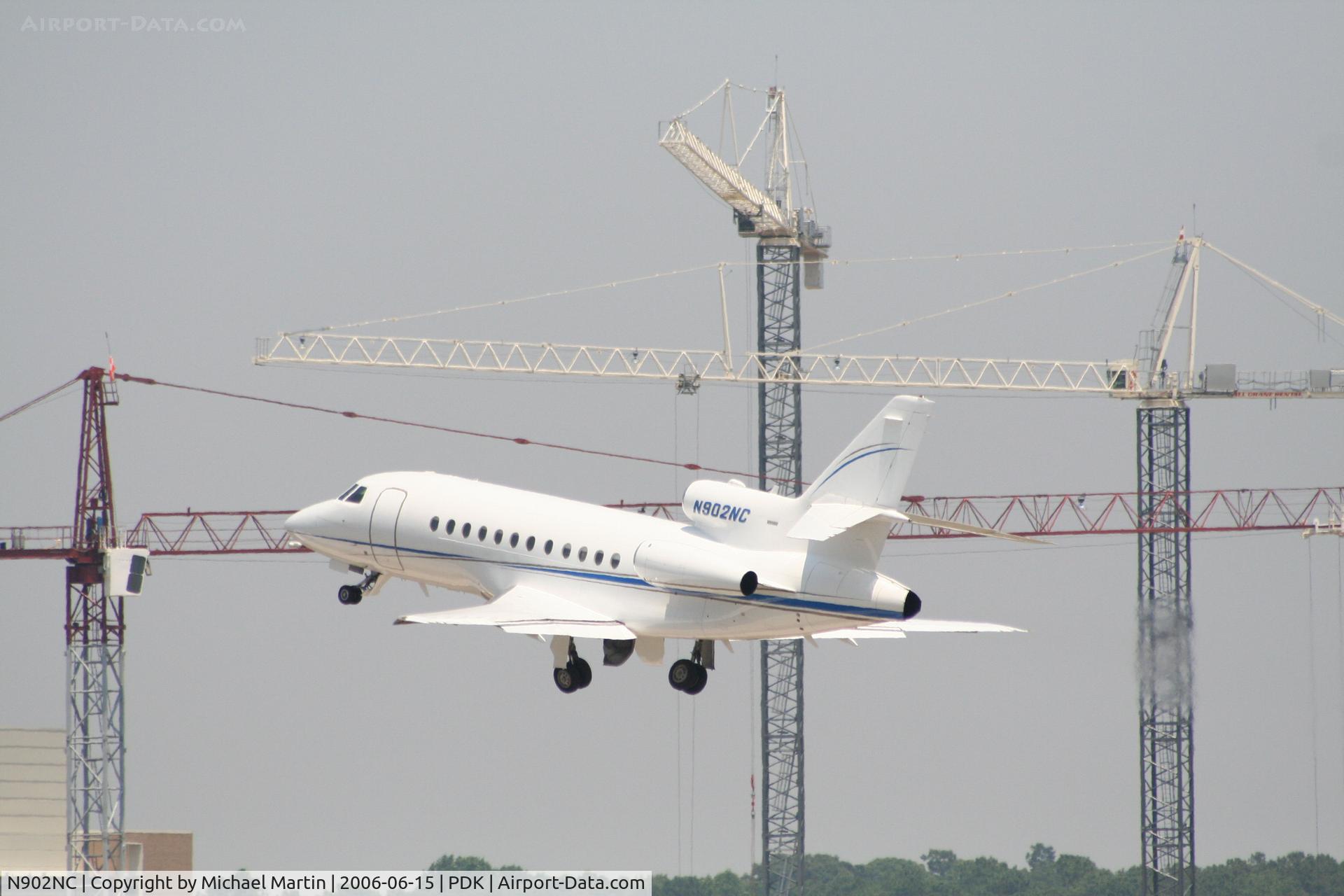 N902NC, 1994 Dassault Falcon 900B C/N 97, Departing 20R - Look out for the cranes!