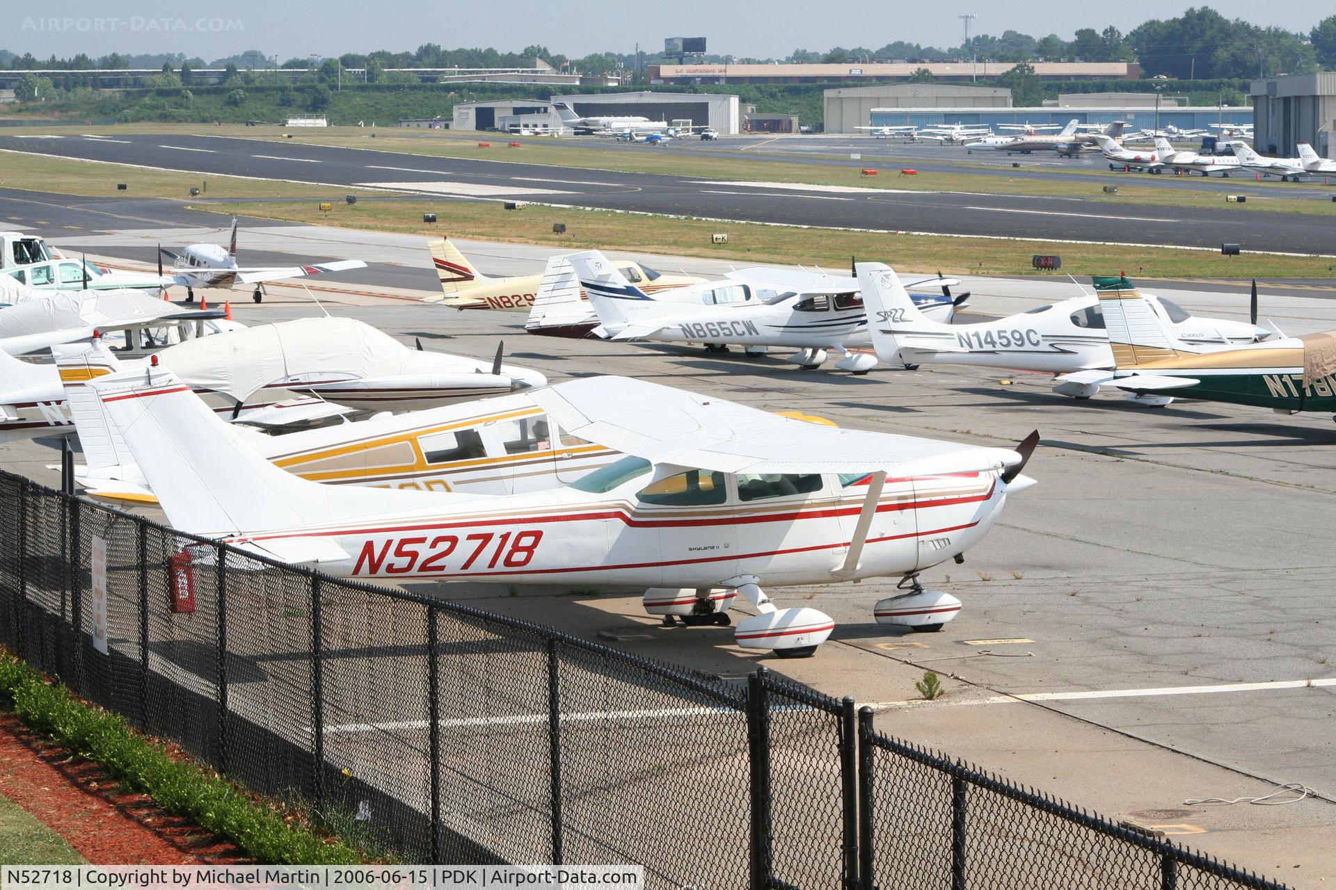 N52718, 1974 Cessna 182P Skylane C/N 18262795, Tied down @ PDK with vairous AC in background