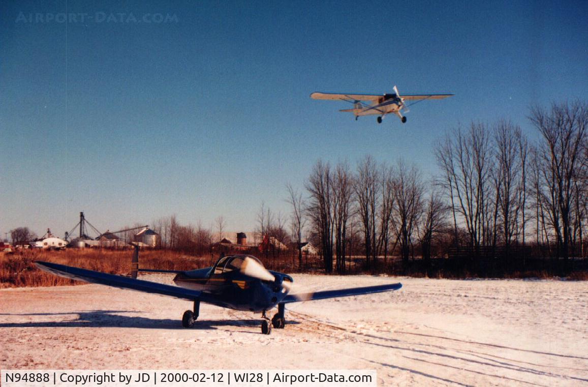 N94888, 1949 Erco 415G Ercoupe C/N 5016, 1949 415-G Ercoupe Club-Air on the ground with Taylorcraft N43296 on final approach