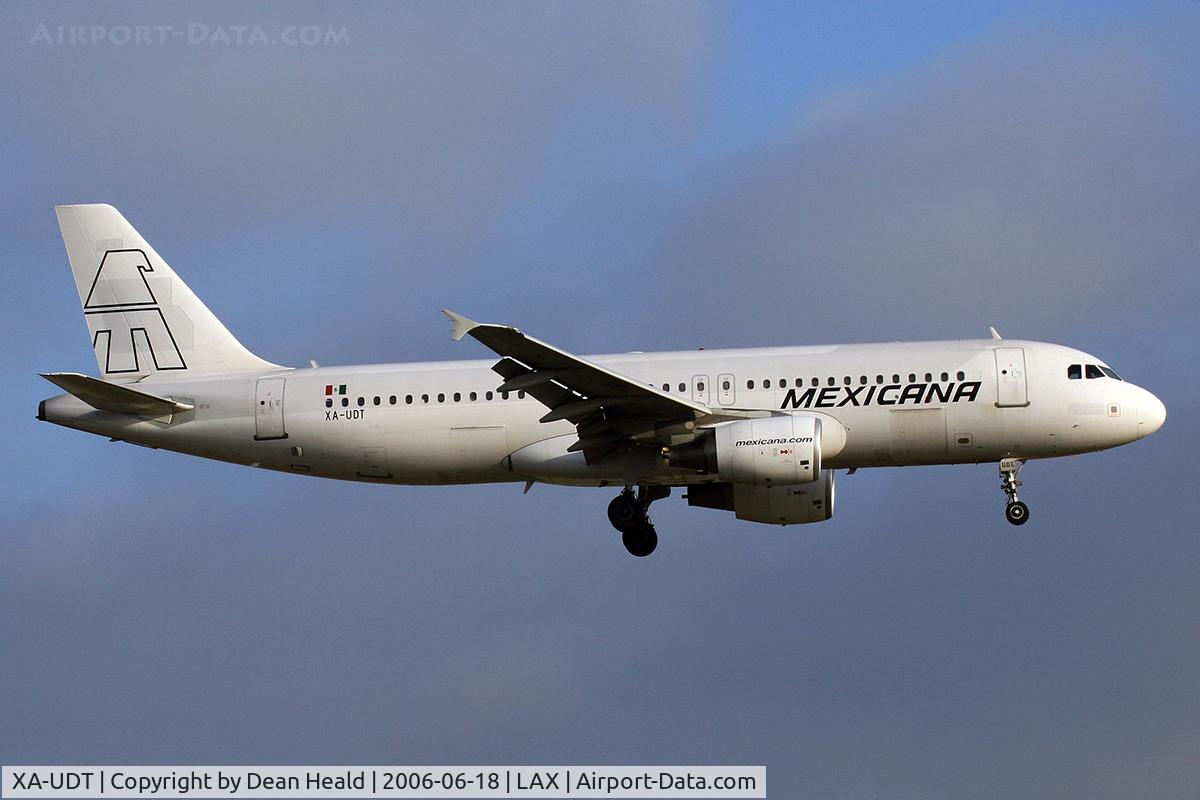 XA-UDT, 2004 Airbus A320-214 C/N 2347, Mexicana Airlines XA-UDT (FLT MXA910) from Licenciado Benito Juarez Int'l (MMMX) on final approach to RWY 24R.  Formerly EC-JDR of Iberia. This is clearly evident by the paint scheme coming through the coat of white paint.
