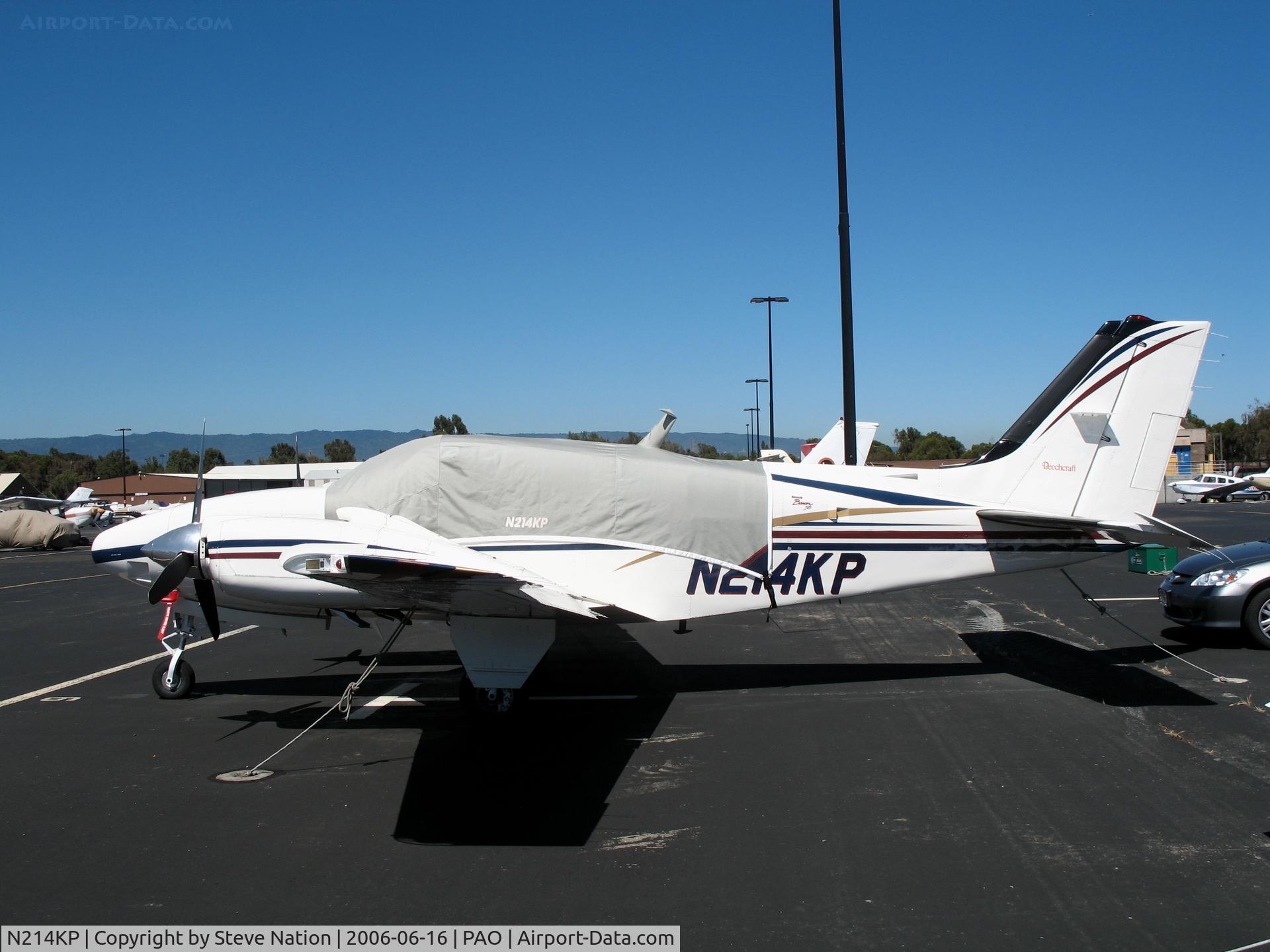N214KP, 1999 Raytheon Aircraft Company 58 C/N TH-1894, Red Sea Group LLC 1999 Raytheon Aircraft 58 with cockpit cover @ Palo Alto Airport, CA