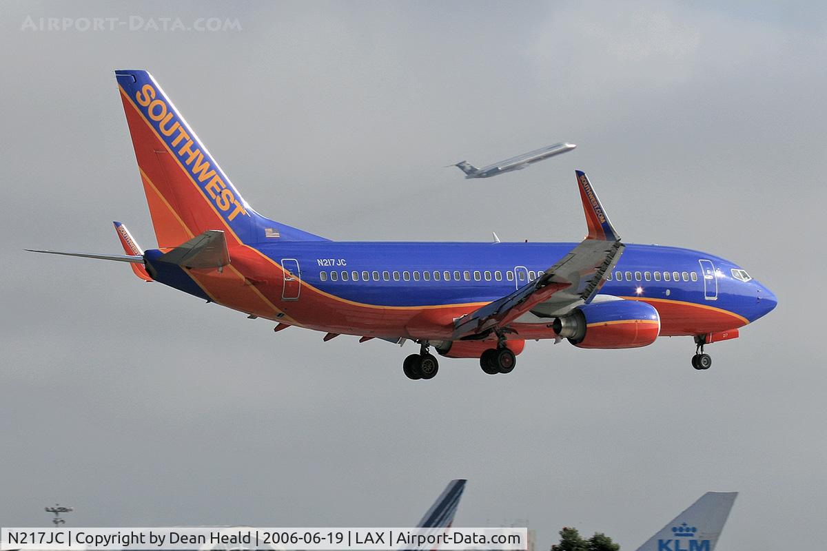 N217JC, 2005 Boeing 737-7H4 C/N 34232, Southwest Airlines N217JC (FLT SWA2537) from Las Vegas McCarran Int'l (KLAS) seconds from touchdown on RWY 24R.