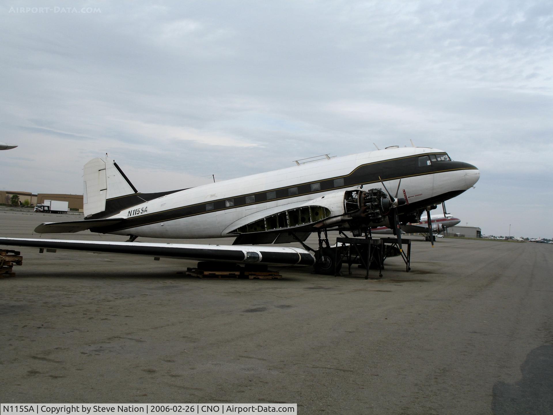 N115SA, 1944 Douglas DC3C-S1C3G (C-47A) C/N 13310, First Flight Inc. Douglas DC-3C with wings unbolted @ Chino Municipal Airport, CA