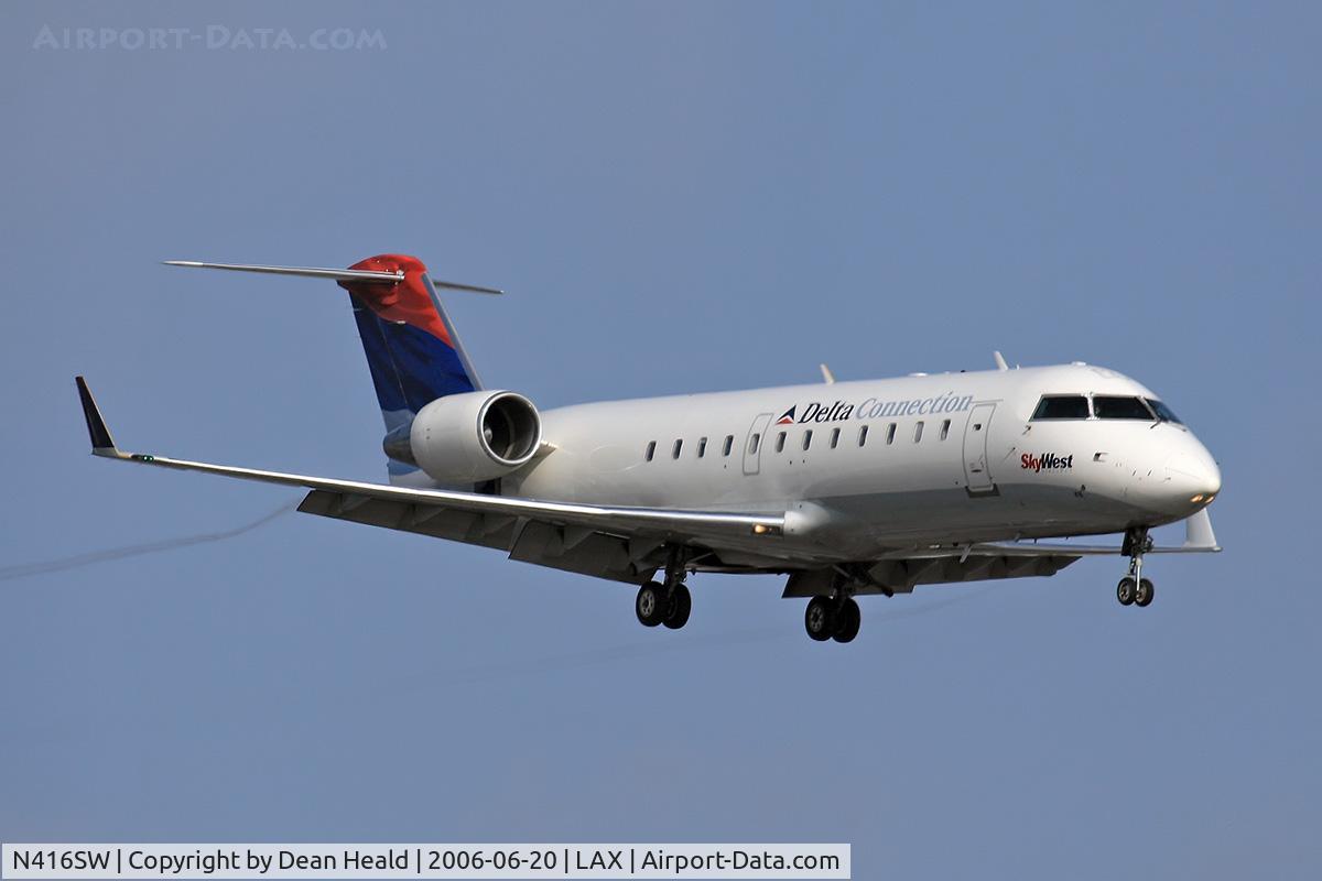 N416SW, 1995 Canadair CRJ-200 (CL-600-2B19) C/N 7089, Delta Connection (Sky West Airlines) N416SW (FLT SKW61G) from Salt Lake City Int'l (KSLC) on final approach to RWY 24R.