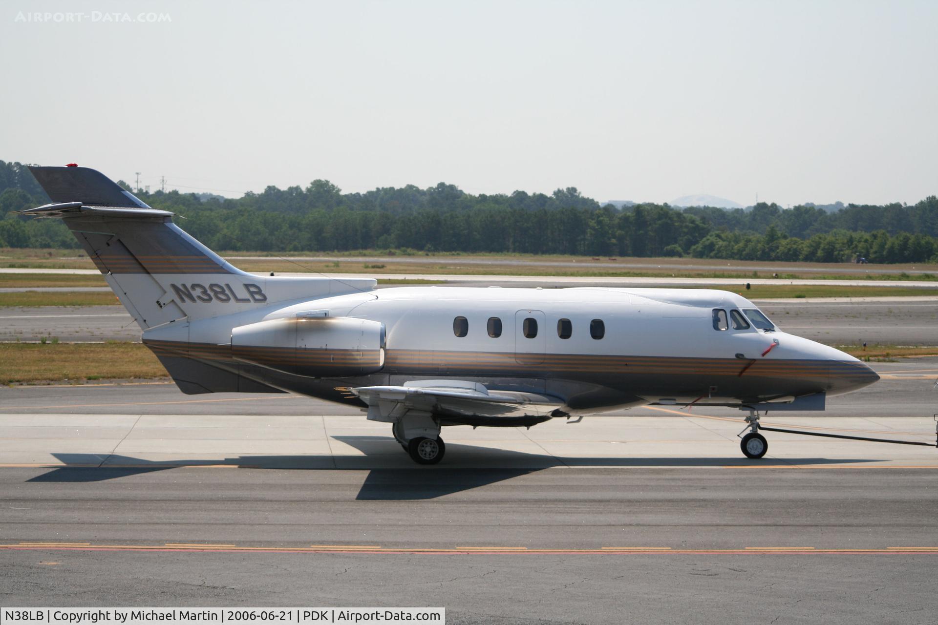 N38LB, 1971 Hawker Siddeley 125-400A C/N 25276, Being towed to parking at Mercury Air Center