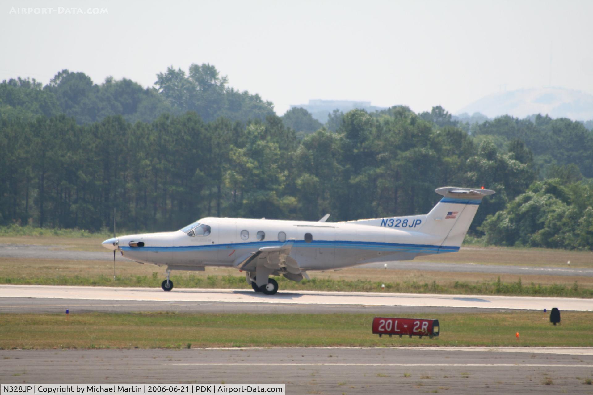 N328JP, 2000 Pilatus PC-12/45 C/N 328, Landing Runway 20R