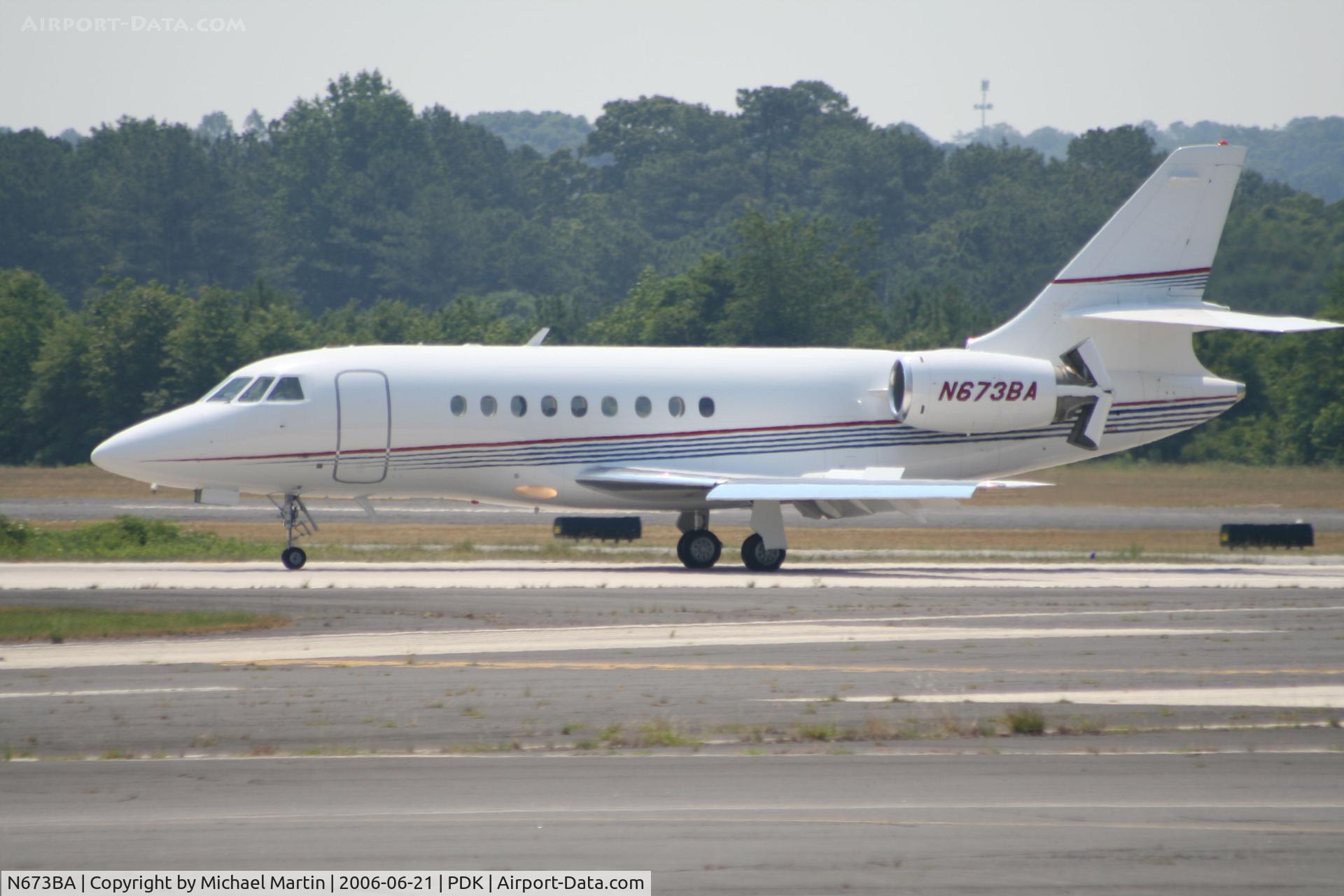 N673BA, 2001 Dassault Falcon 2000 C/N 173, Landing 20R with airbrakes extended