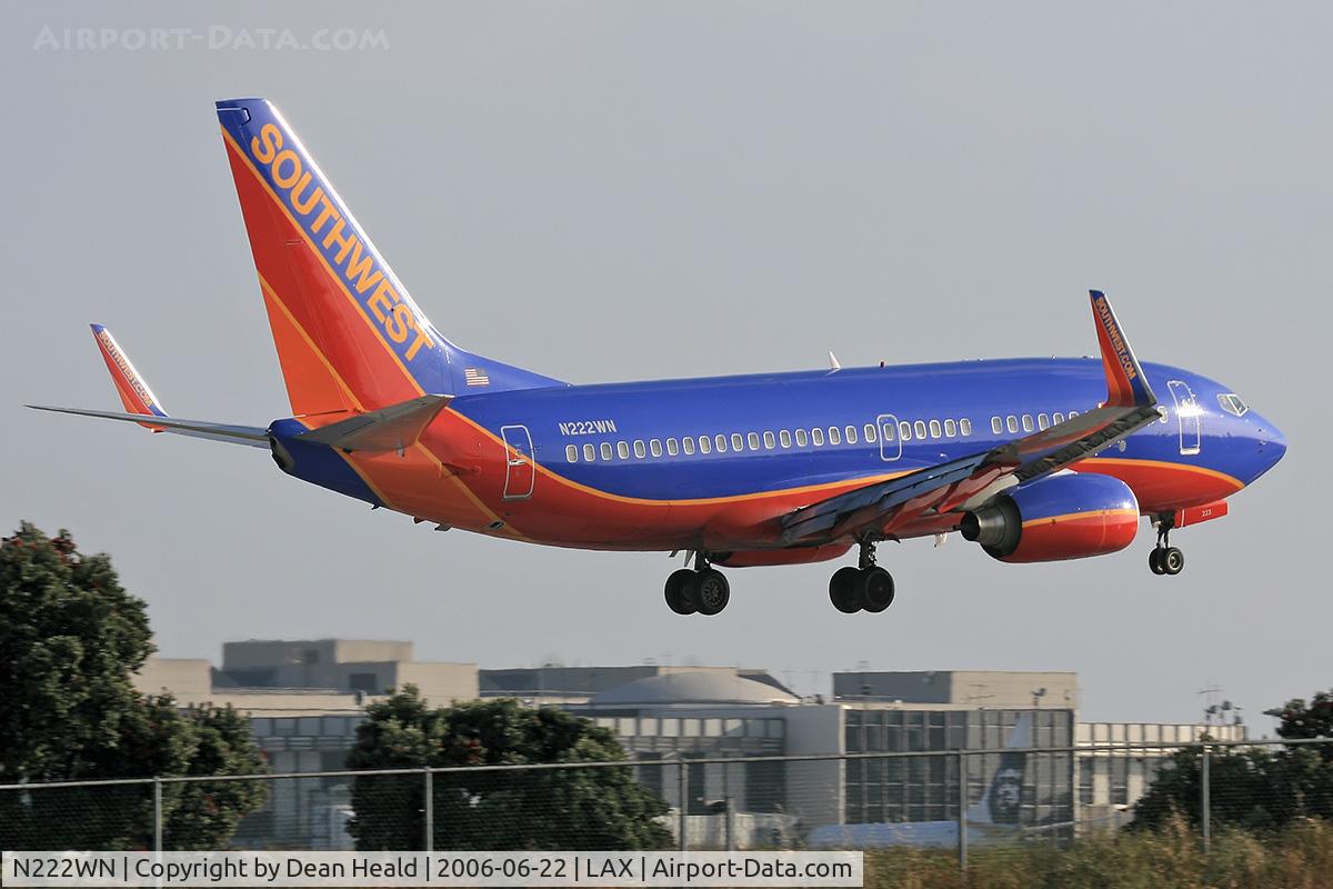 N222WN, 2005 Boeing 737-7H4 C/N 34290, Southwest Airlines N222WN (FLT SWA563) from Metropolitan Oakland Int'l (KOAK) seconds from touchdown on RWY 24R.