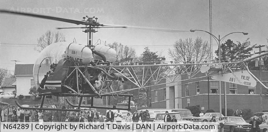 N64289, 1967 Bell 47G-3B-1 Sioux C/N 3668, The Danville Va. Police helicopter gives a demo. in front of the Danville Life Saving Crew when first in Danville in 1975. Used from '75 to Nov.1980 when prior to takeoff ,the copter slammed into a hanger causing extensive damage.