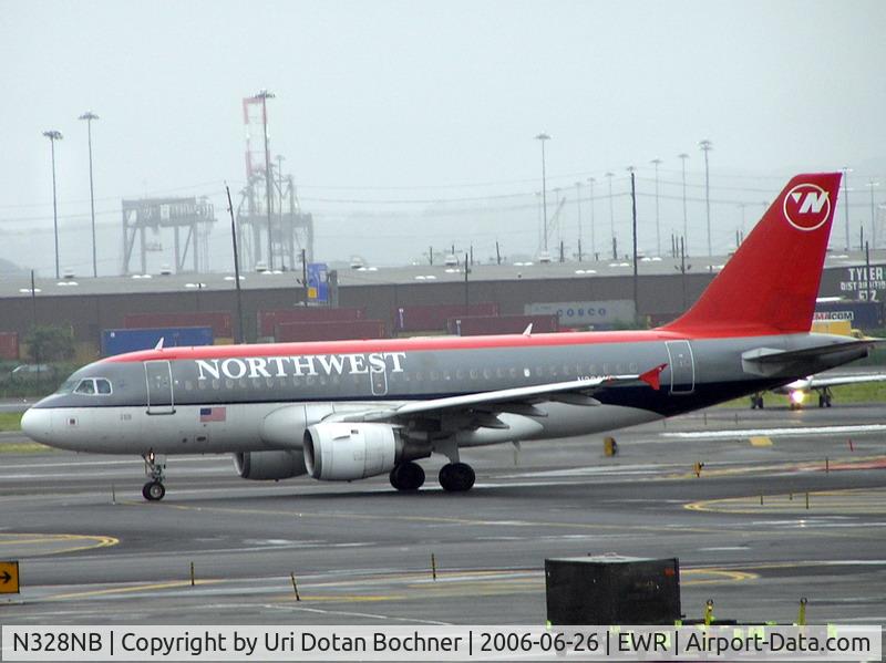 N328NB, 2001 Airbus A319-114 C/N 1520, on a rainy day at EWR