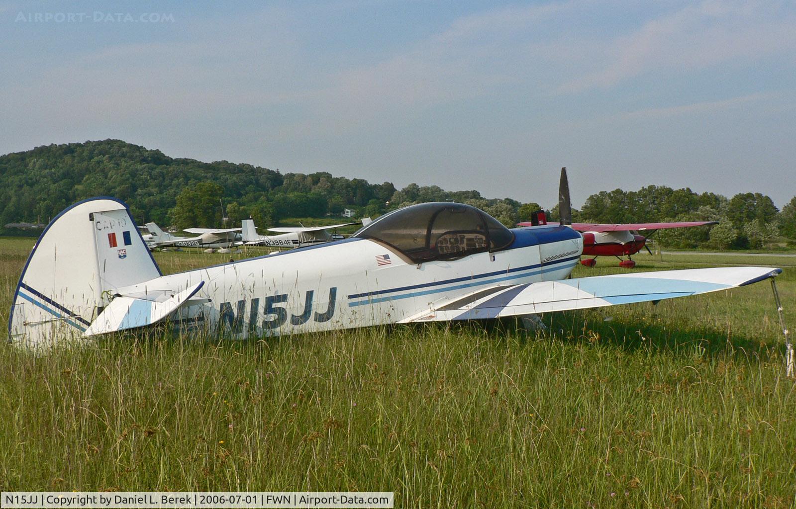 N15JJ, 1984 Mudry CAP-10B C/N 201, Even on the ground among the tall grass, this sporty-looking plane looks fast.