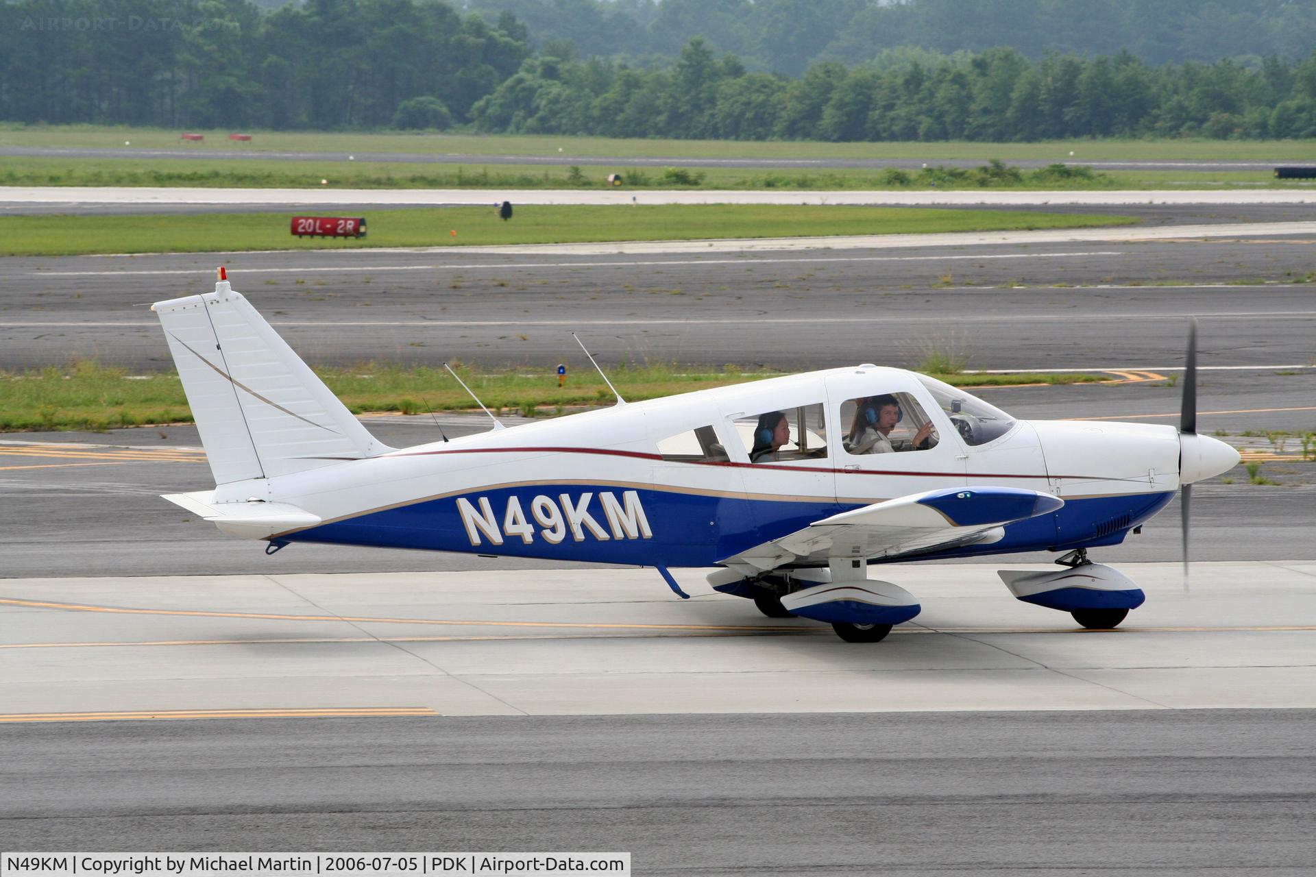 N49KM, 1969 Piper PA-28-180 C/N 28-5729, Taxing to Mercury Air Center
