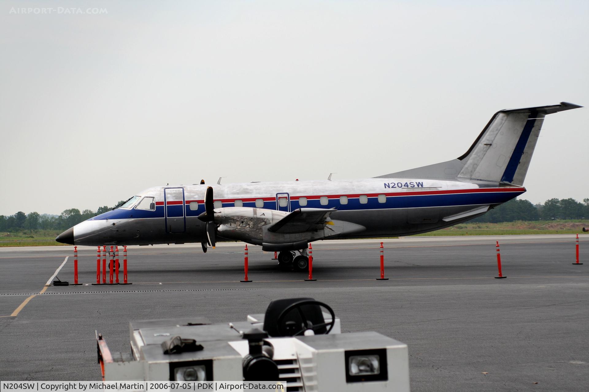 N204SW, 1991 Embraer EMB-120 Brasilia C/N 120.243, Tied down @ Mercury Air Center