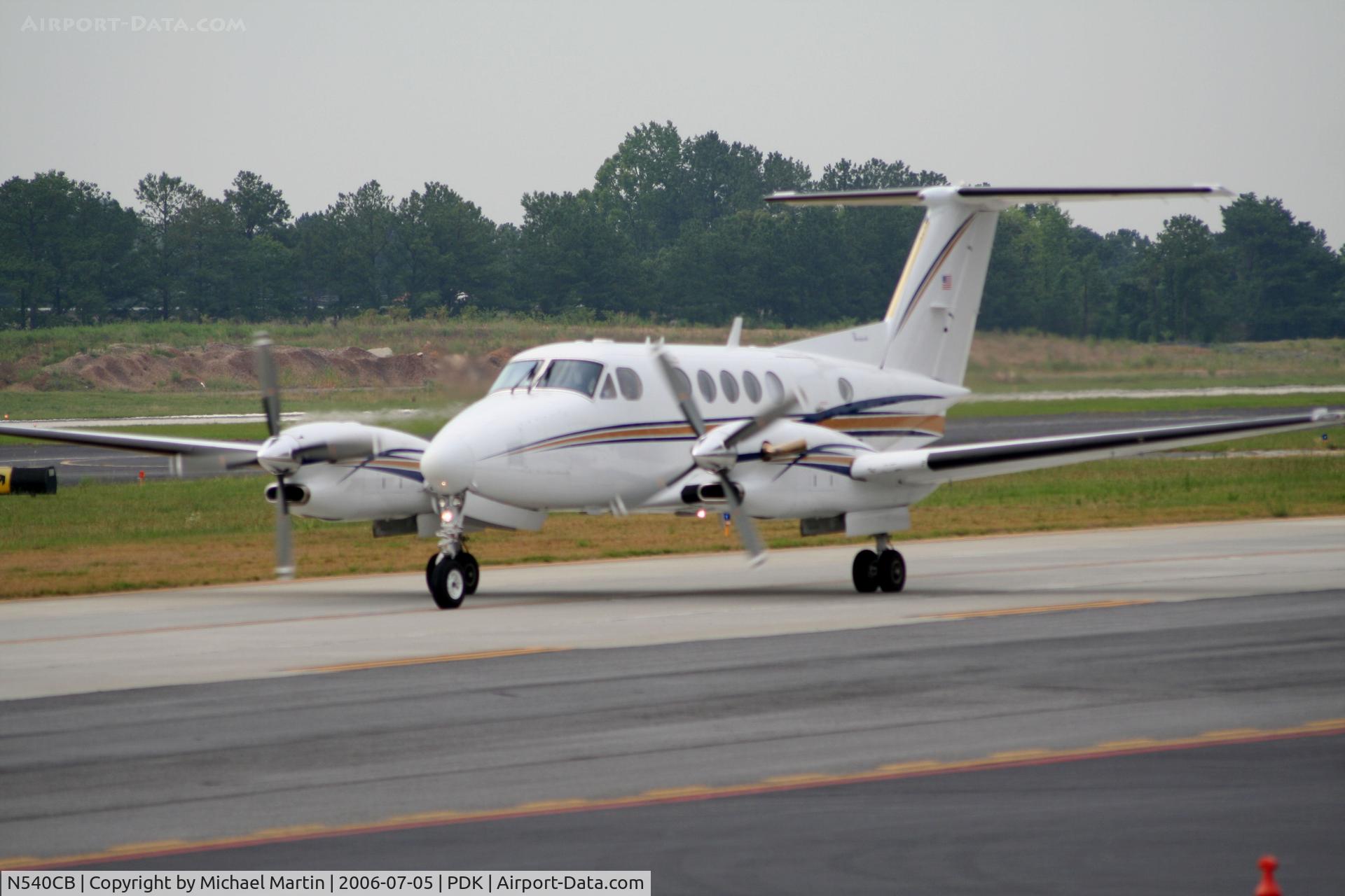 N540CB, 1987 Beech Super King Air 300LW C/N FA-135, Taxing past Mercury Air Service