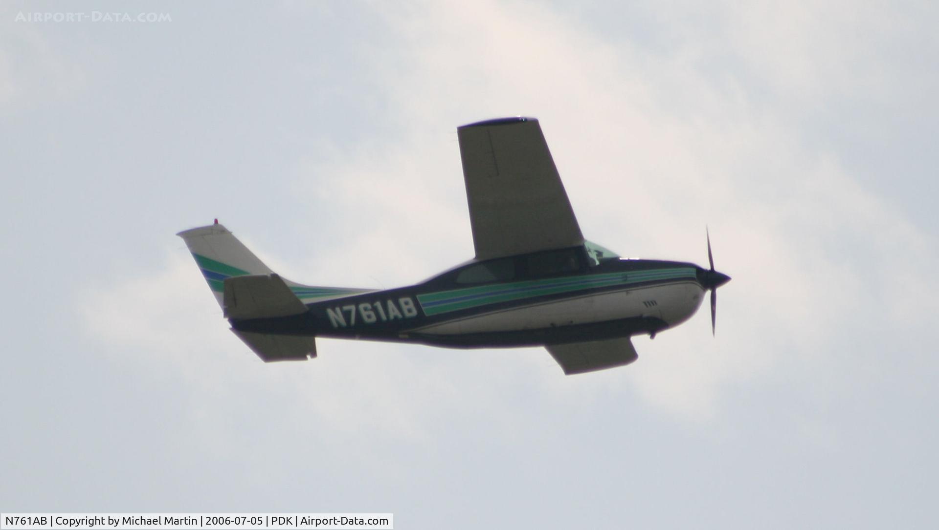 N761AB, 1977 Cessna 210M Centurion C/N 21062092, Over flying PDK