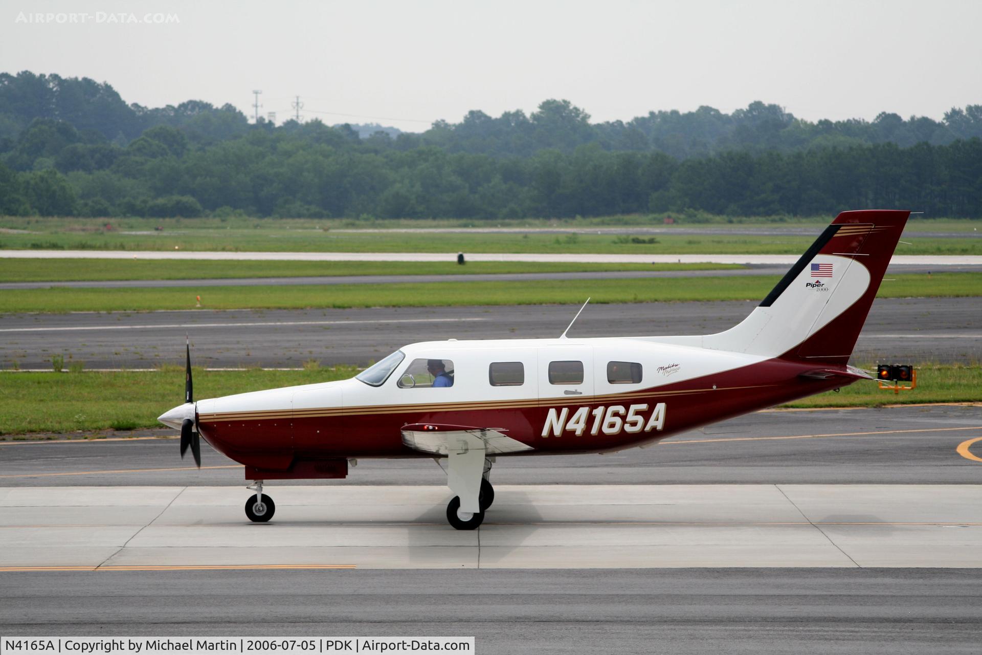 N4165A, 2000 Piper PA-46-350P Malibu Mirage C/N 4636278, Taxing past Mercury Air Service