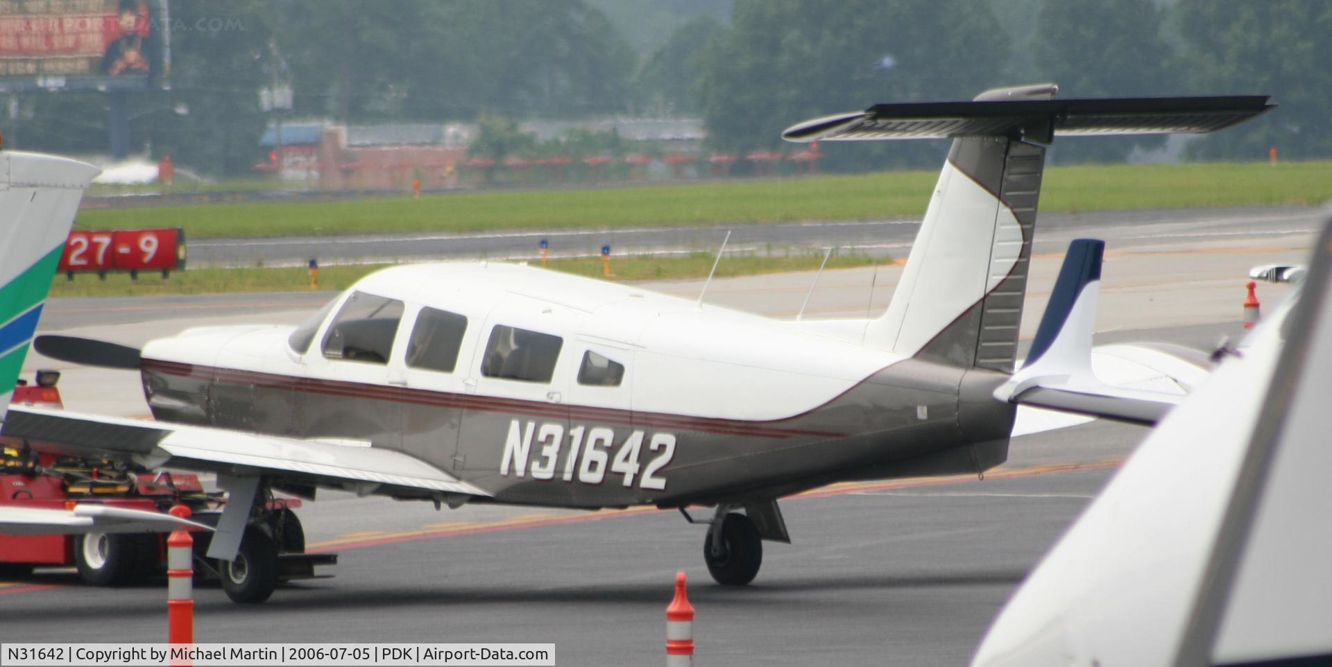 N31642, 1978 Piper PA-32RT-300 C/N 32R-7885114, Being towed to parking at Mercury Air Center