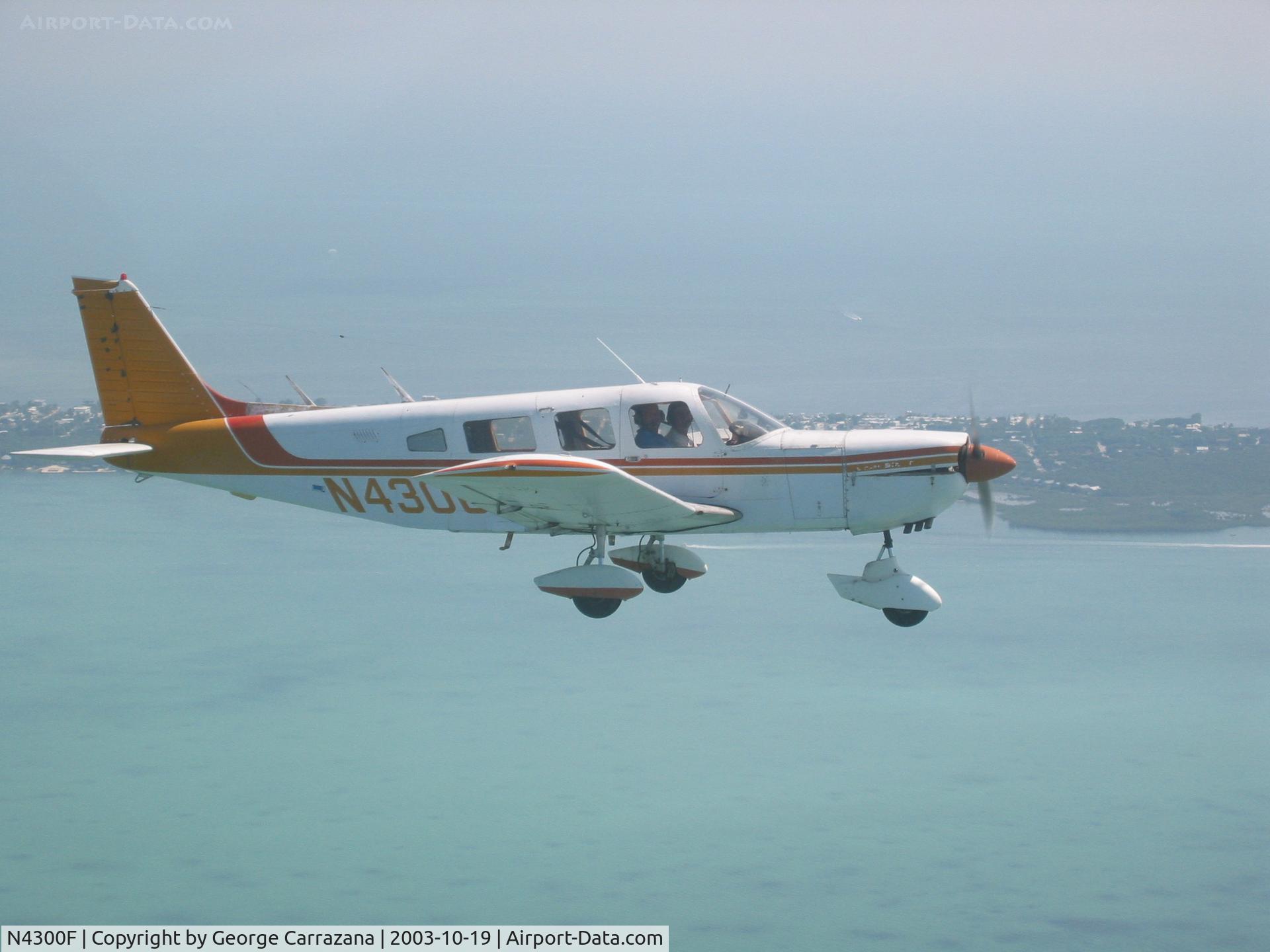 N4300F, 1976 Piper PA-32-300 Cherokee Six C/N 32-7640112, Piper Cherokee Six flying over the upper Keys.