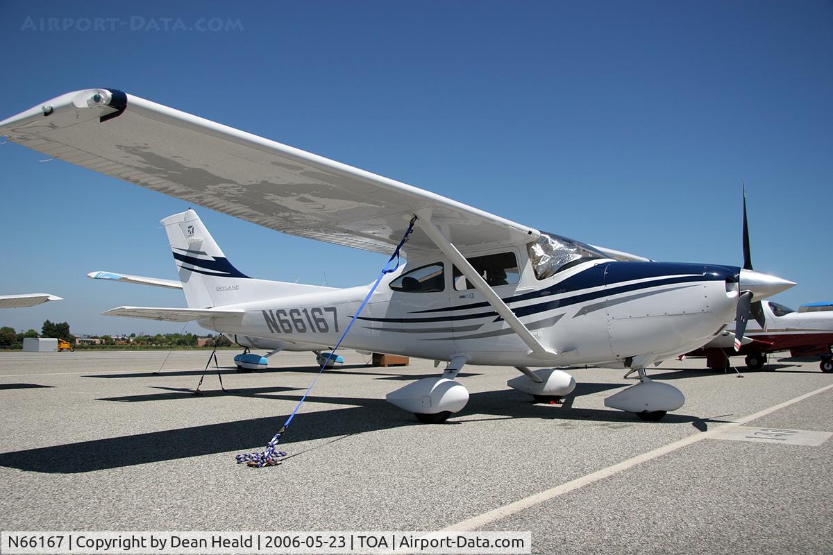 N66167, Cessna 150M C/N 15075889, 2005 Cessna 182T N66167 parked on the ramp at Torrance Municipal Airport (KTOA) - Torrance, California.