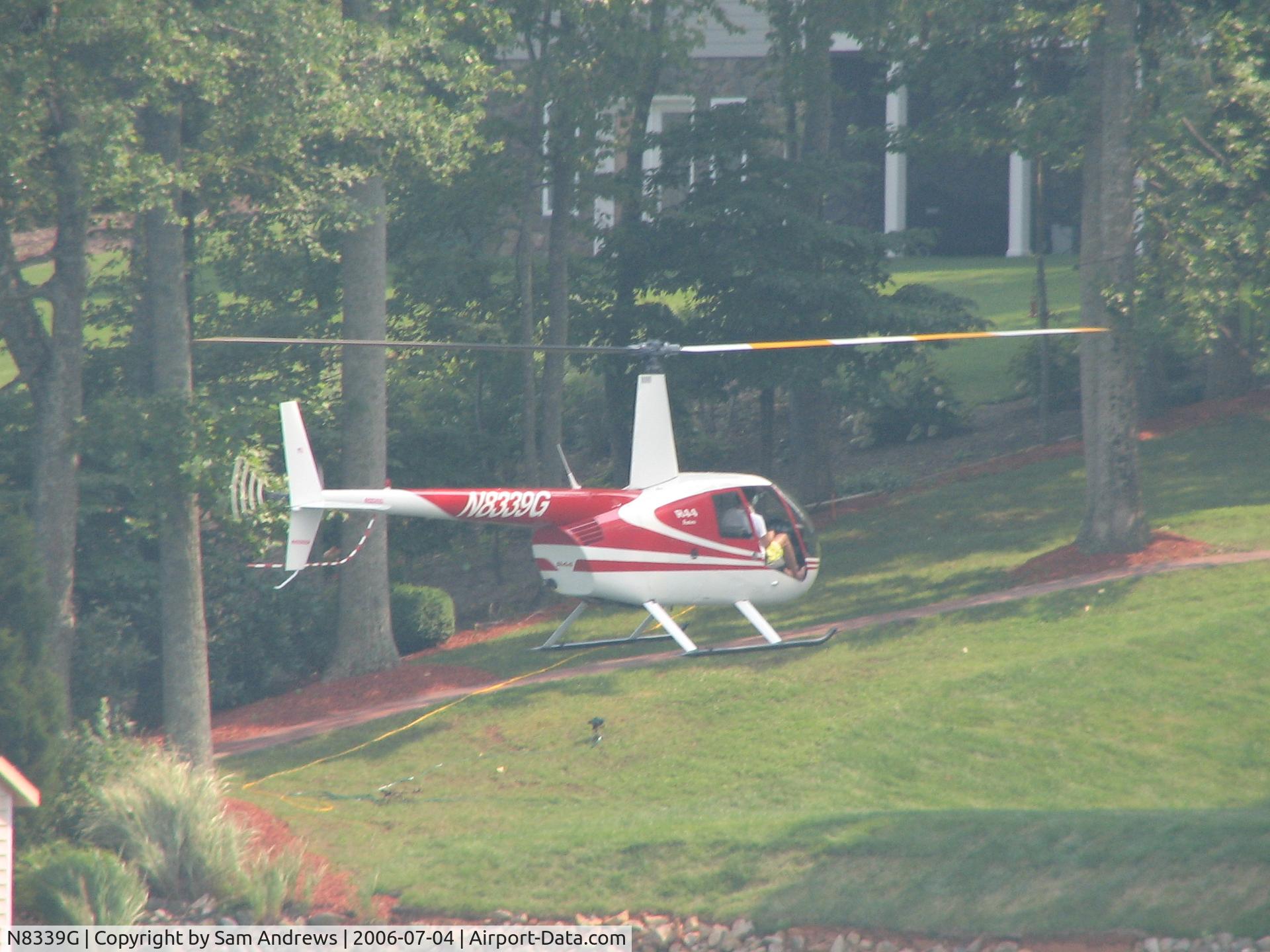 N8339G, 1996 Robinson R44 C/N 0243, beginning the approach to hover and land