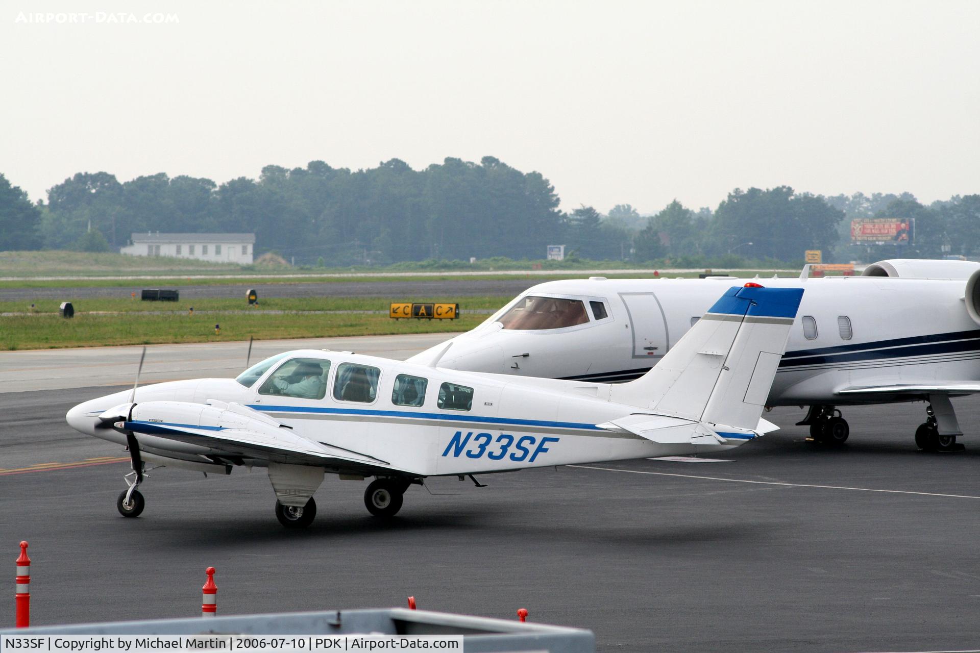 N33SF, 1972 Beech 58 Baron C/N TH-190, Taxing from Mercury Air Service