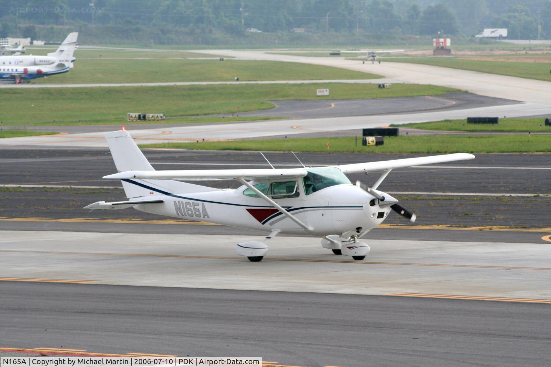 N165A, 1979 Cessna 182Q Skylane C/N 18267062, Taxing past Mercury Air Service