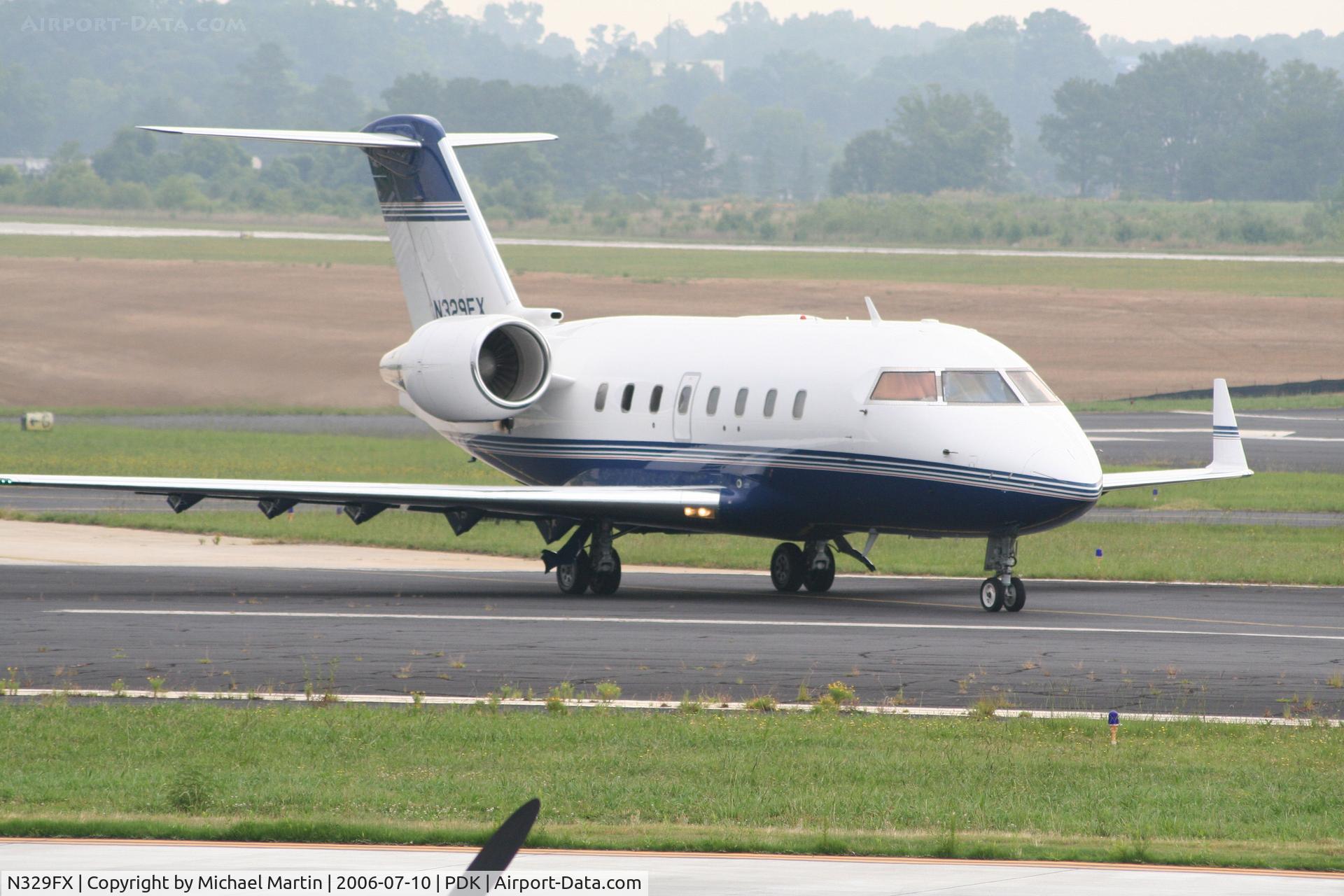 N329FX, 2002 Bombardier Challenger 604 (CL-600-2B16) C/N 5541, Taxing from Signature Air