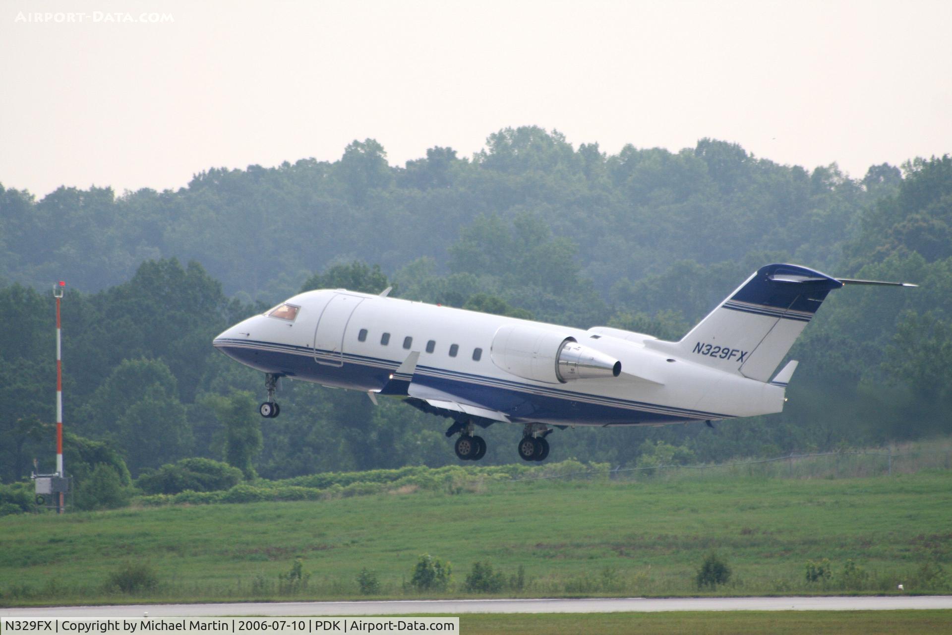 N329FX, 2002 Bombardier Challenger 604 (CL-600-2B16) C/N 5541, Departing 2R