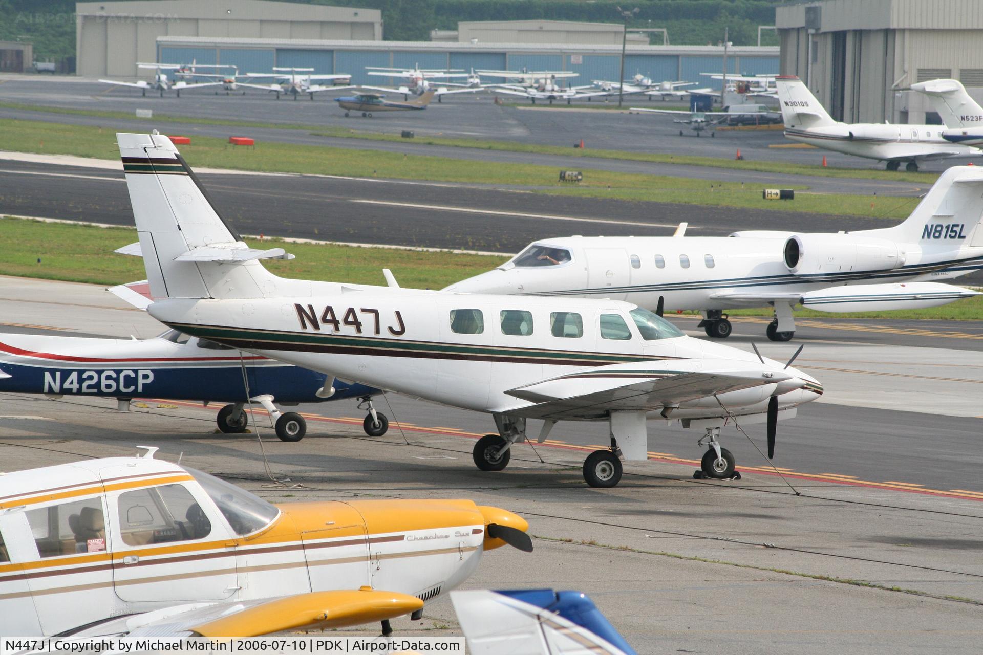 N447J, 1984 Cessna T303 Crusader C/N T30300314, Tied down @ Epps with other aircraft