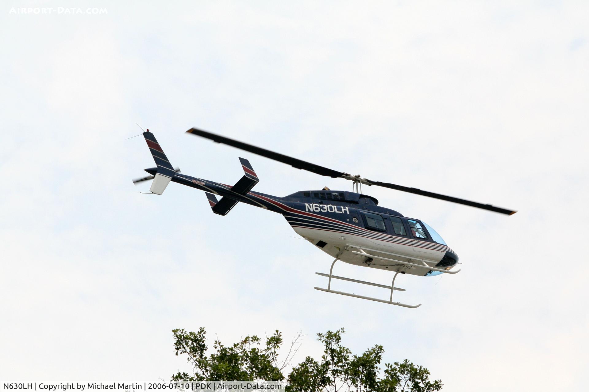 N630LH, 1992 Bell 206L-4 LongRanger IV LongRanger C/N 52011, Preparing to land at Jet Fueling