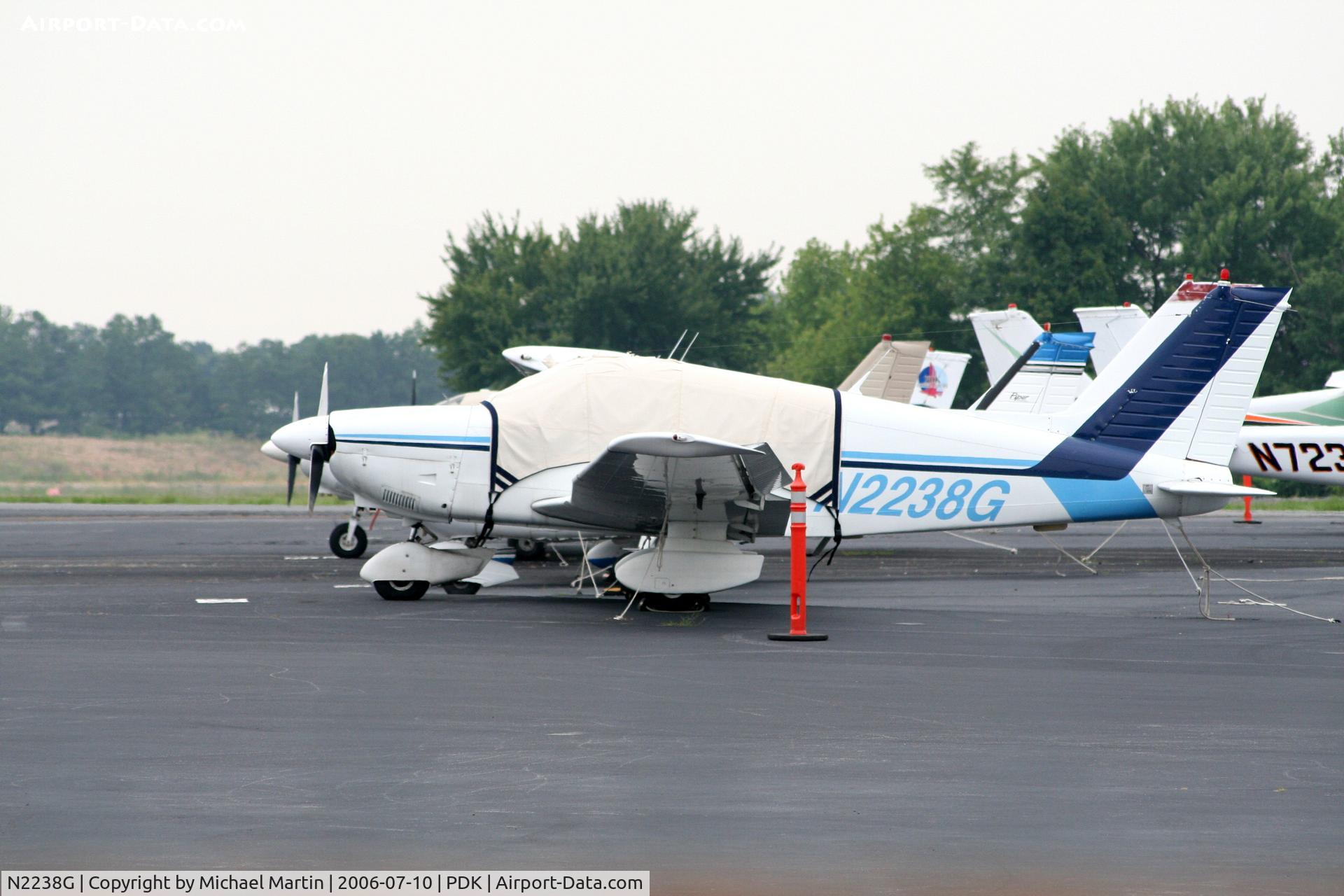 N2238G, 1979 Piper PA-28-181 C/N 28-7990418, Tied down @ PDK with vairous AC in background