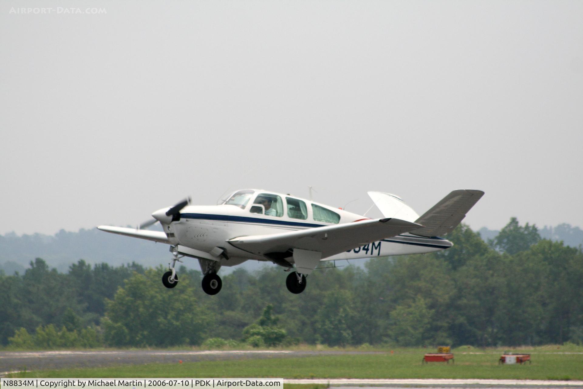 N8834M, 1964 Beech S35 Bonanza C/N D-7352, Taking off from 2L