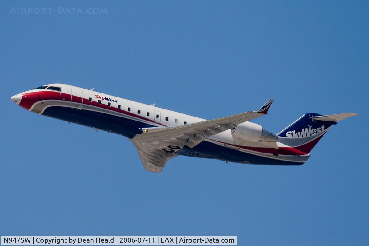 N947SW, 2003 Bombardier CRJ-200LR (CL-600-2B19) C/N 7786, Sky West Airlines N947SW (FLT SKW6498) climbing out from RWY 25R enroute to Tucson Int'l (KTUS).