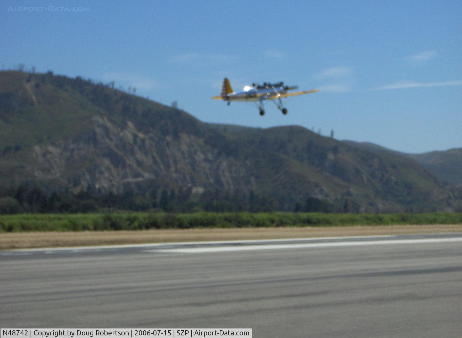 N48742, 1941 Ryan Aeronautical ST3KR C/N 1298, 1941 Ryan Aeronautical ST-3KR as PT-22, Kinner R5 160 Hp, mirror polished, takeoff climbout Runway 22